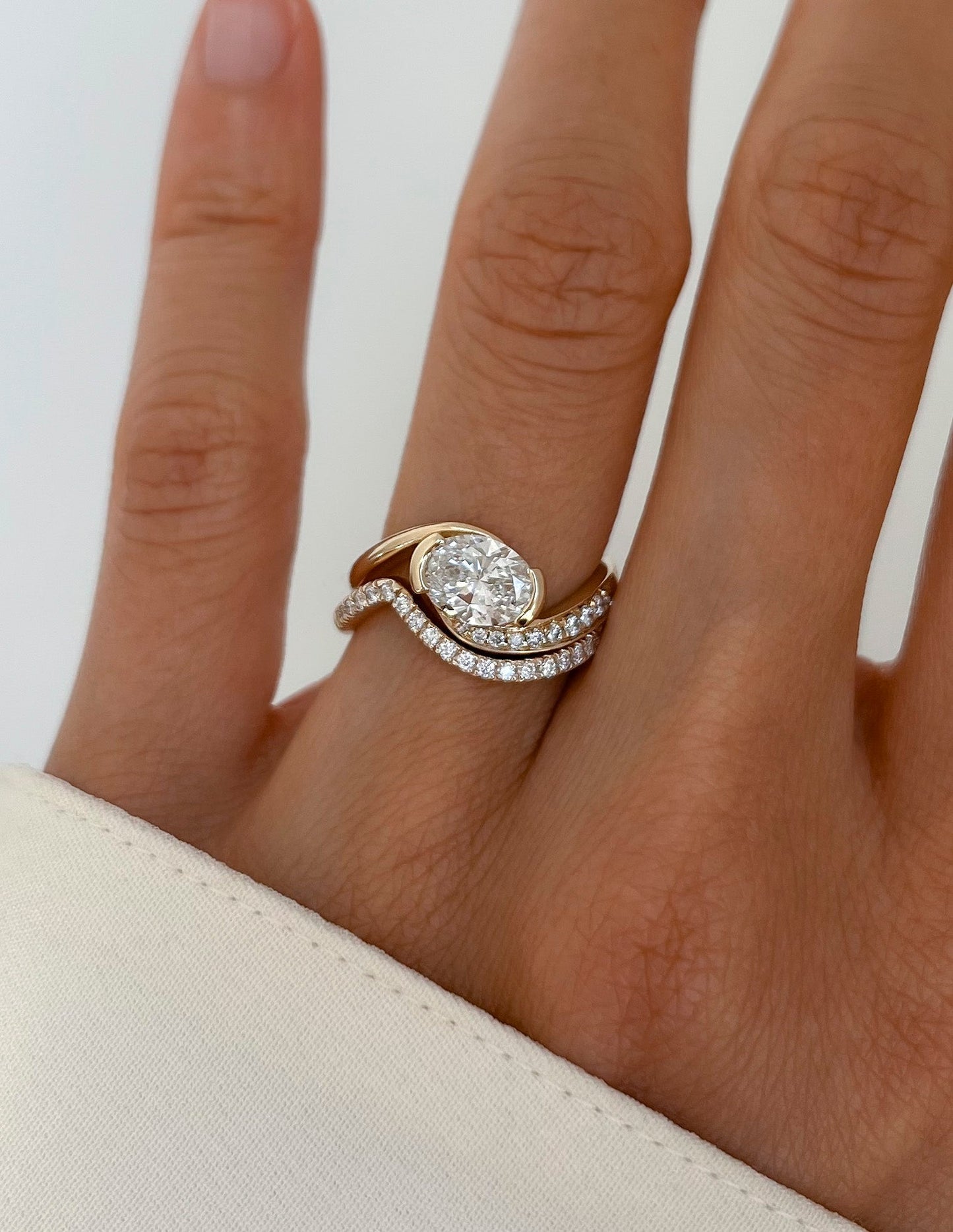 Solitaire Half Bezel Rapture & Pave Band- 1 CT Oval Lab Grown Diamond Bridal SetSolitaire Half Bezel Rapture & Pave Band- 1 CT Oval Lab Grown Diamond Bridal Set - Front view