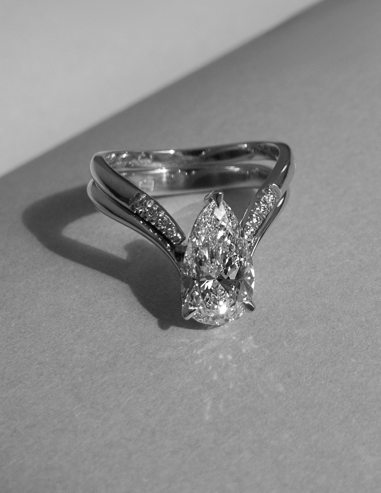 Solitaire Rapture & Plain Band- 2 CT Pear Lab Grown Diamond Bridal SetSolitaire Rapture & Plain Band- 2 CT Pear Lab Grown Diamond Bridal Set - Detail view