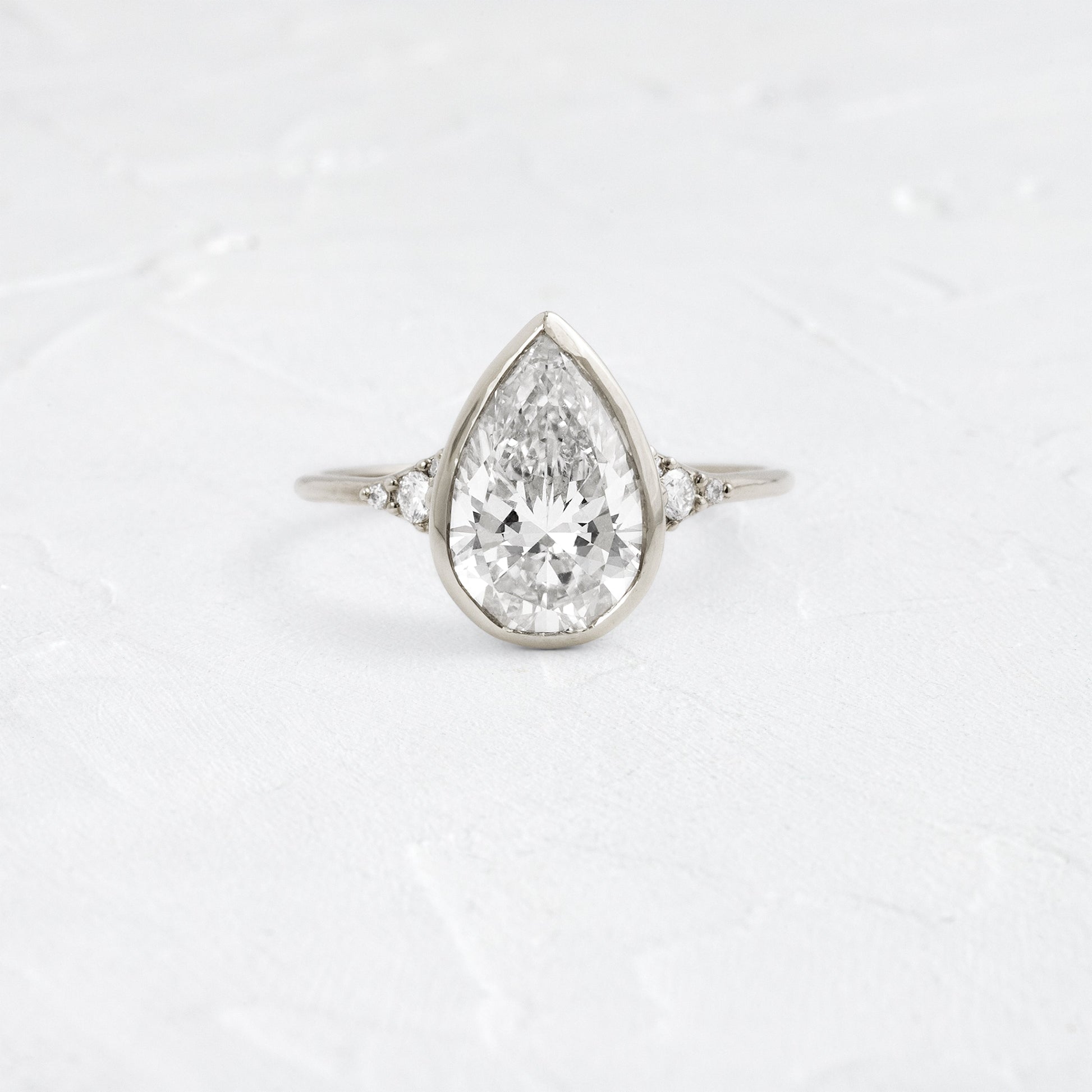 Bezel & Cluster Style-Pear Lab Grown Diamond Engagement Ring - Lifestyle