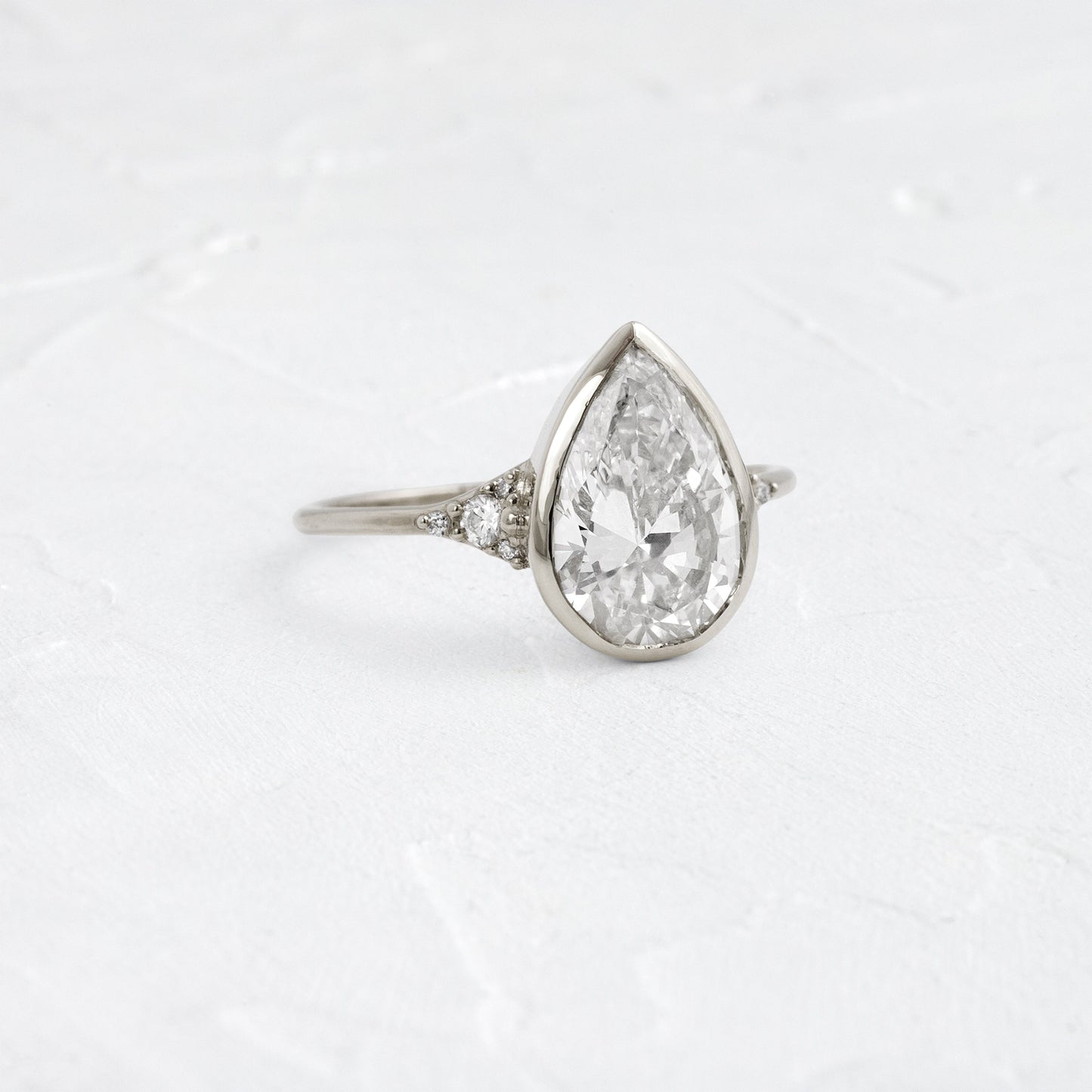 Bezel & Cluster Style-Pear Lab Grown Diamond Engagement Ring - Front view