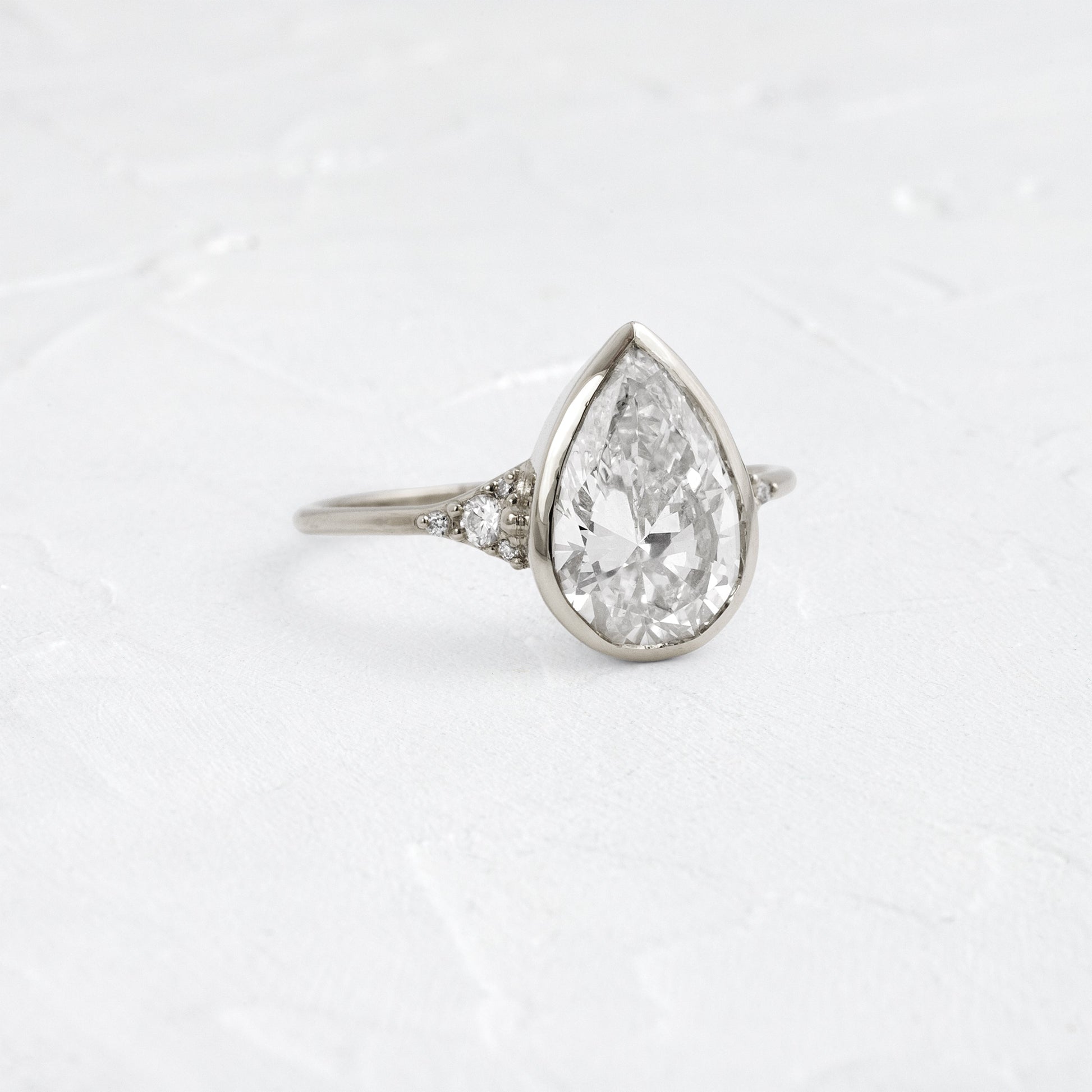 Bezel & Cluster Style-Pear Lab Grown Diamond Engagement Ring - Front view