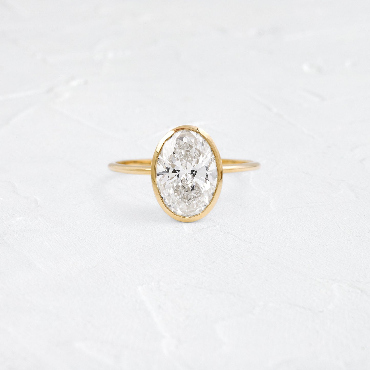 Bezel Hidden Stone-Oval Lab Grown Diamond Engagement Ring - Front view