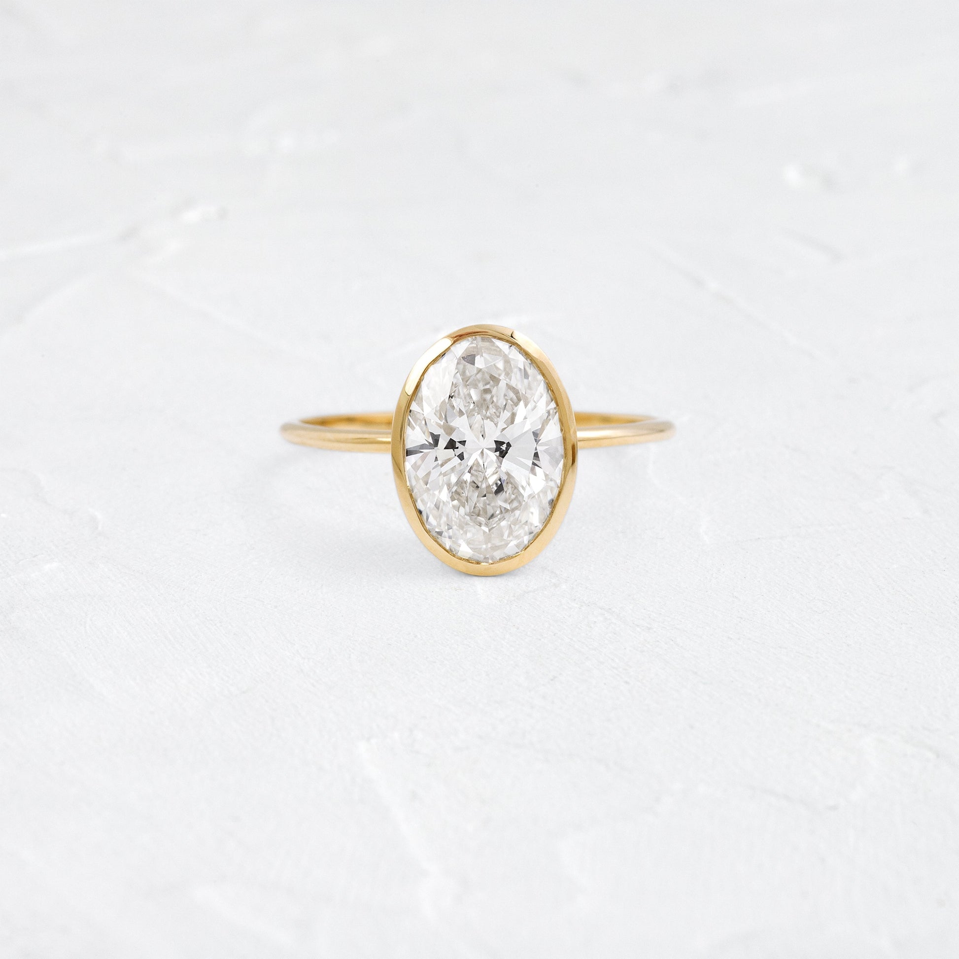 Bezel Hidden Stone-Oval Lab Grown Diamond Engagement Ring - Front view