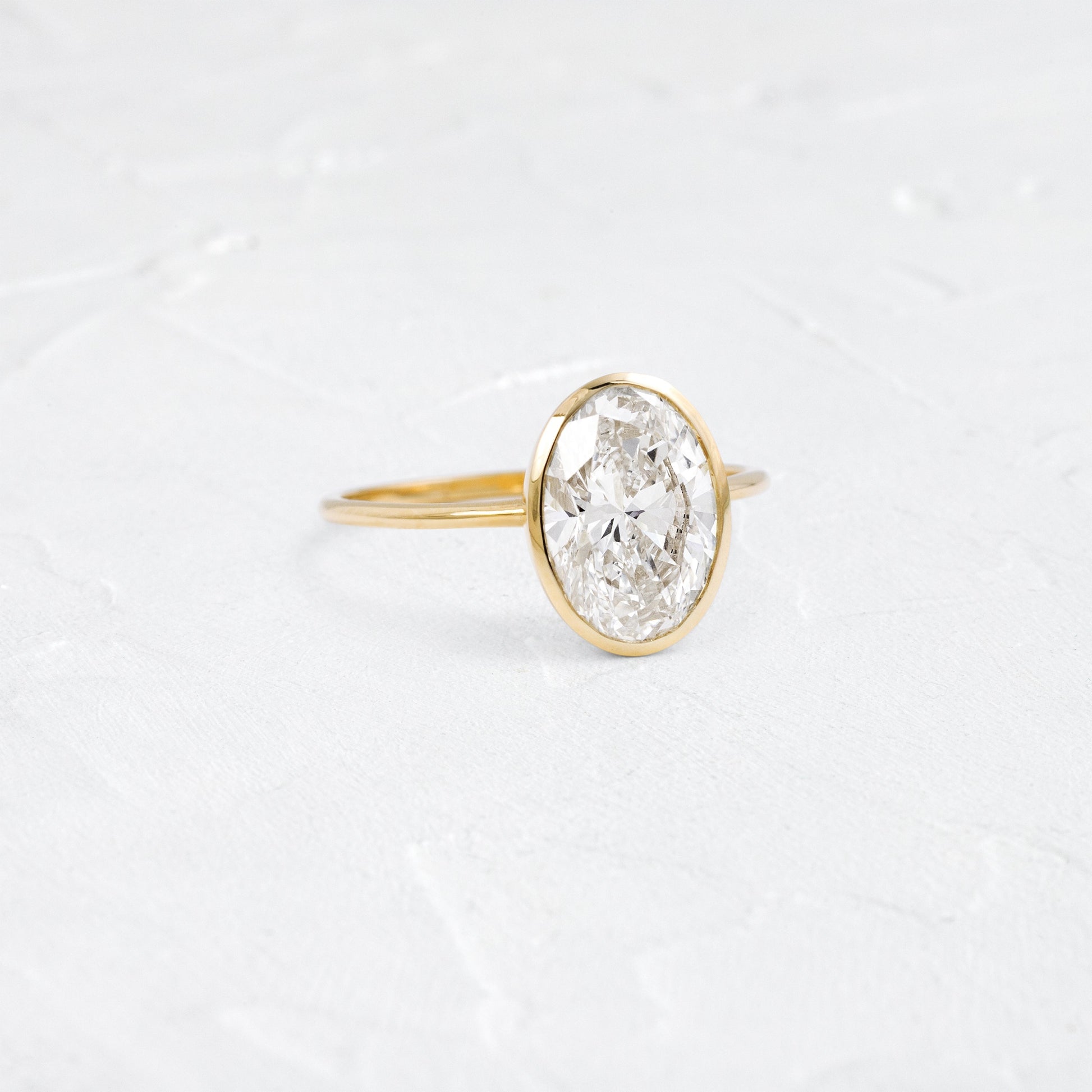 Bezel Hidden Stone-Oval Lab Grown Diamond Engagement Ring - Front view
