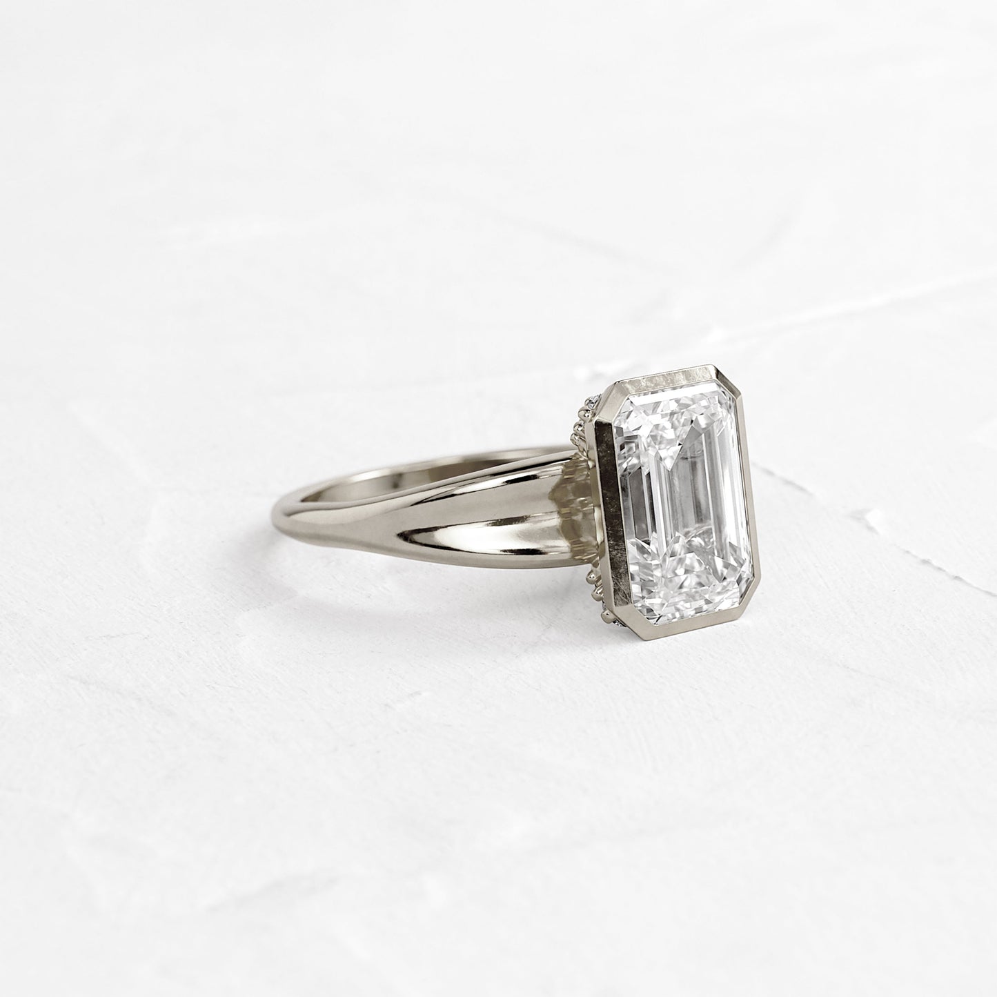 Bezel Tapered Shank with Hidden Stones-Emerald Lab Grown Diamond Engagement Ring - On model