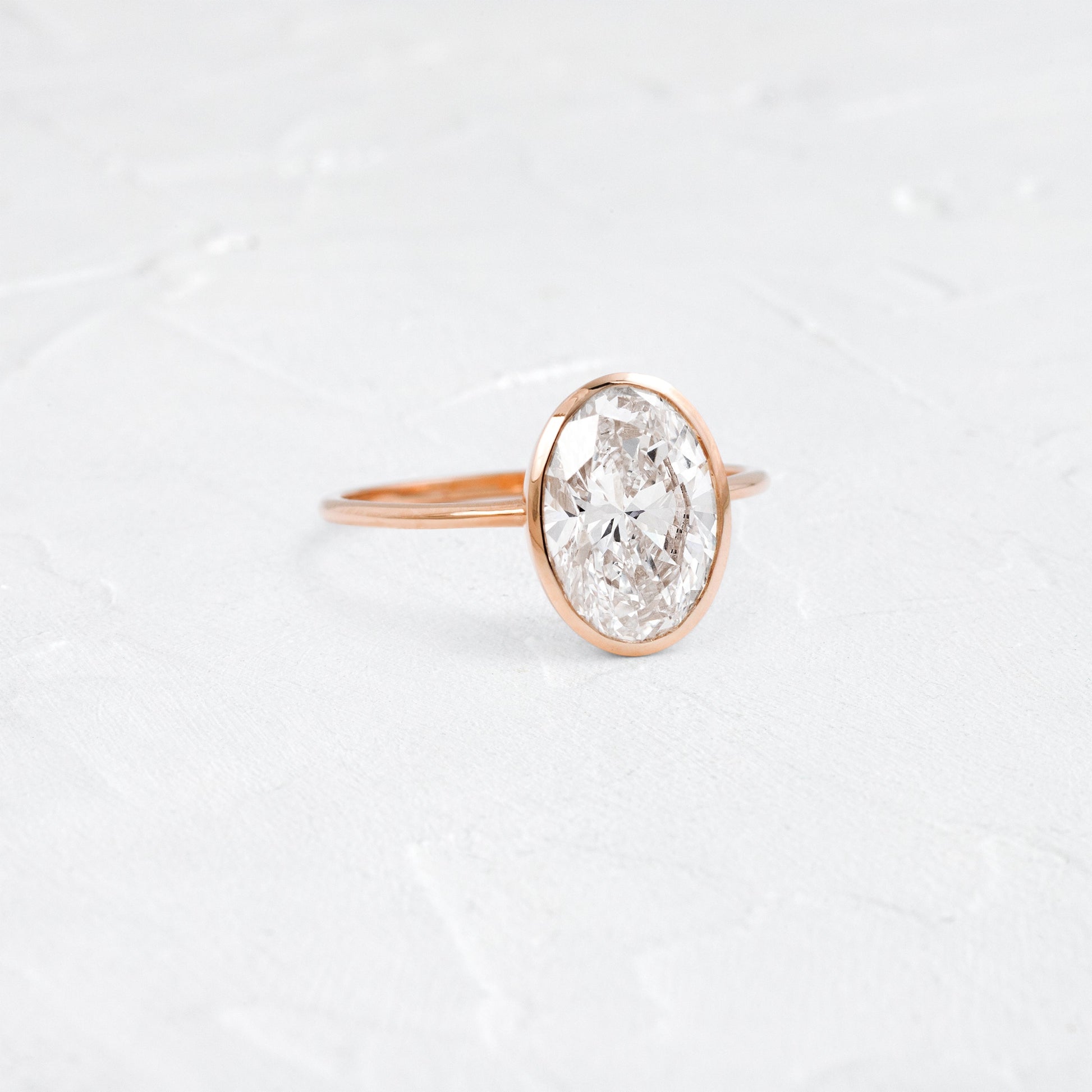 Bezel with Hidden Stones-Oval Lab Grown Diamond Engagement Ring - On model