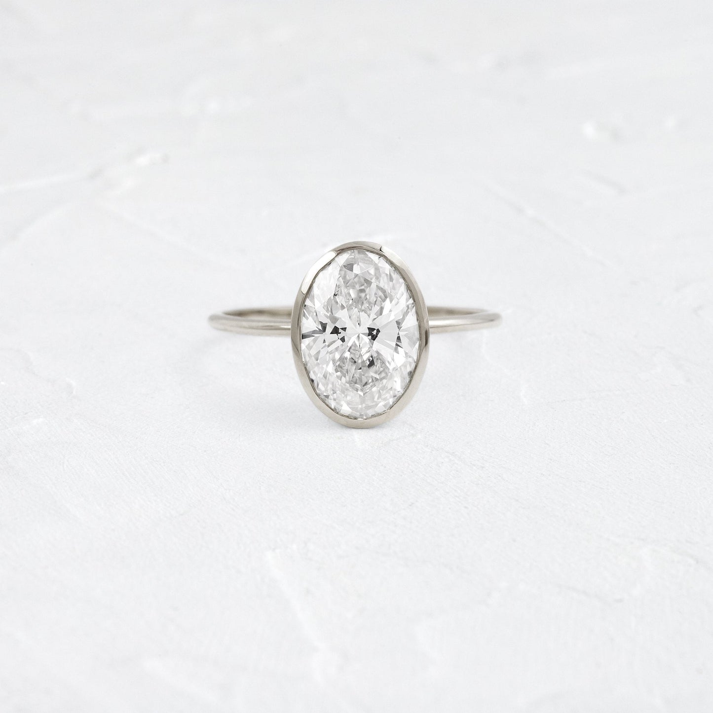 Bezel with Hidden Stones-Oval Lab Grown Diamond Engagement Ring - On model