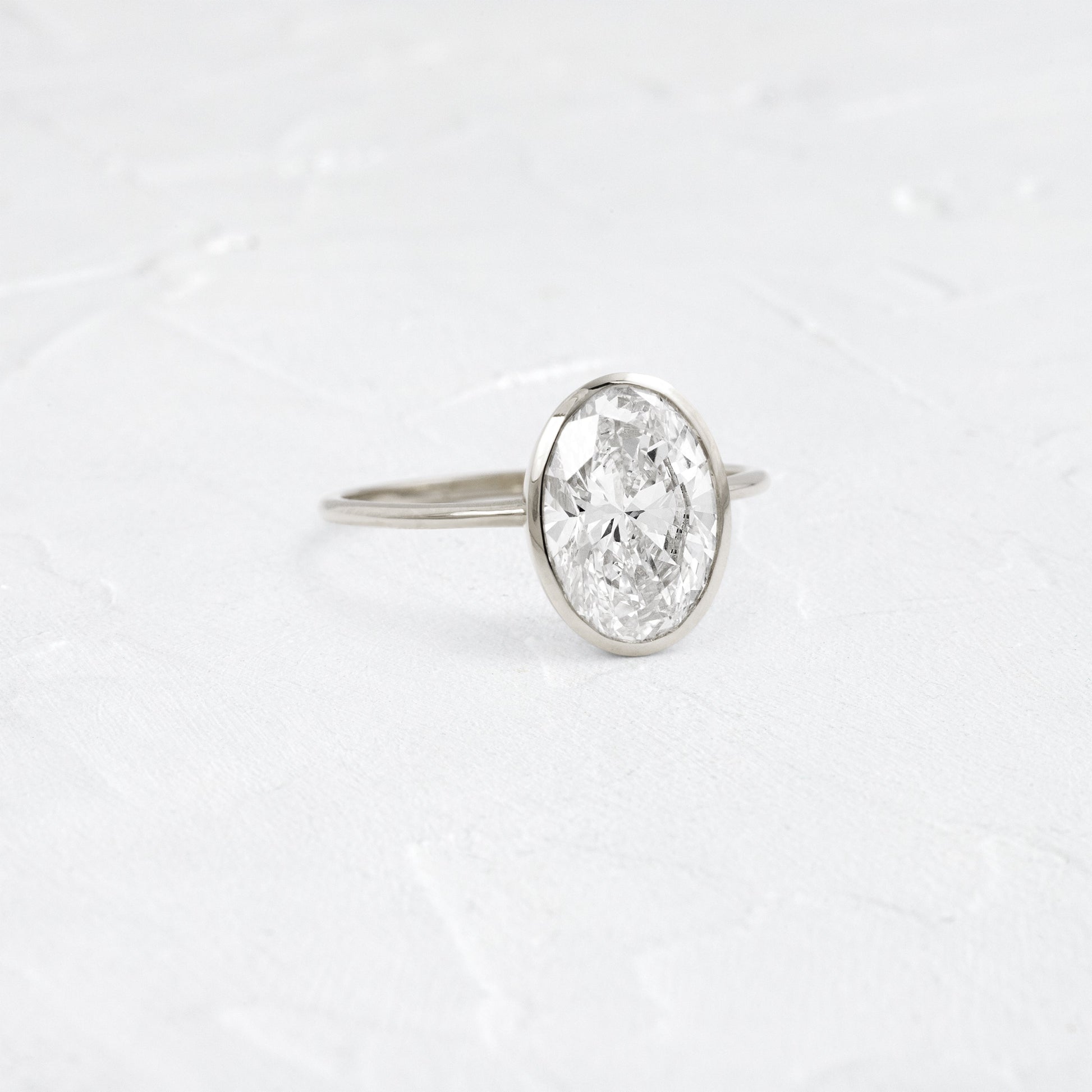 Bezel with Hidden Stones-Oval Lab Grown Diamond Engagement Ring - Lifestyle
