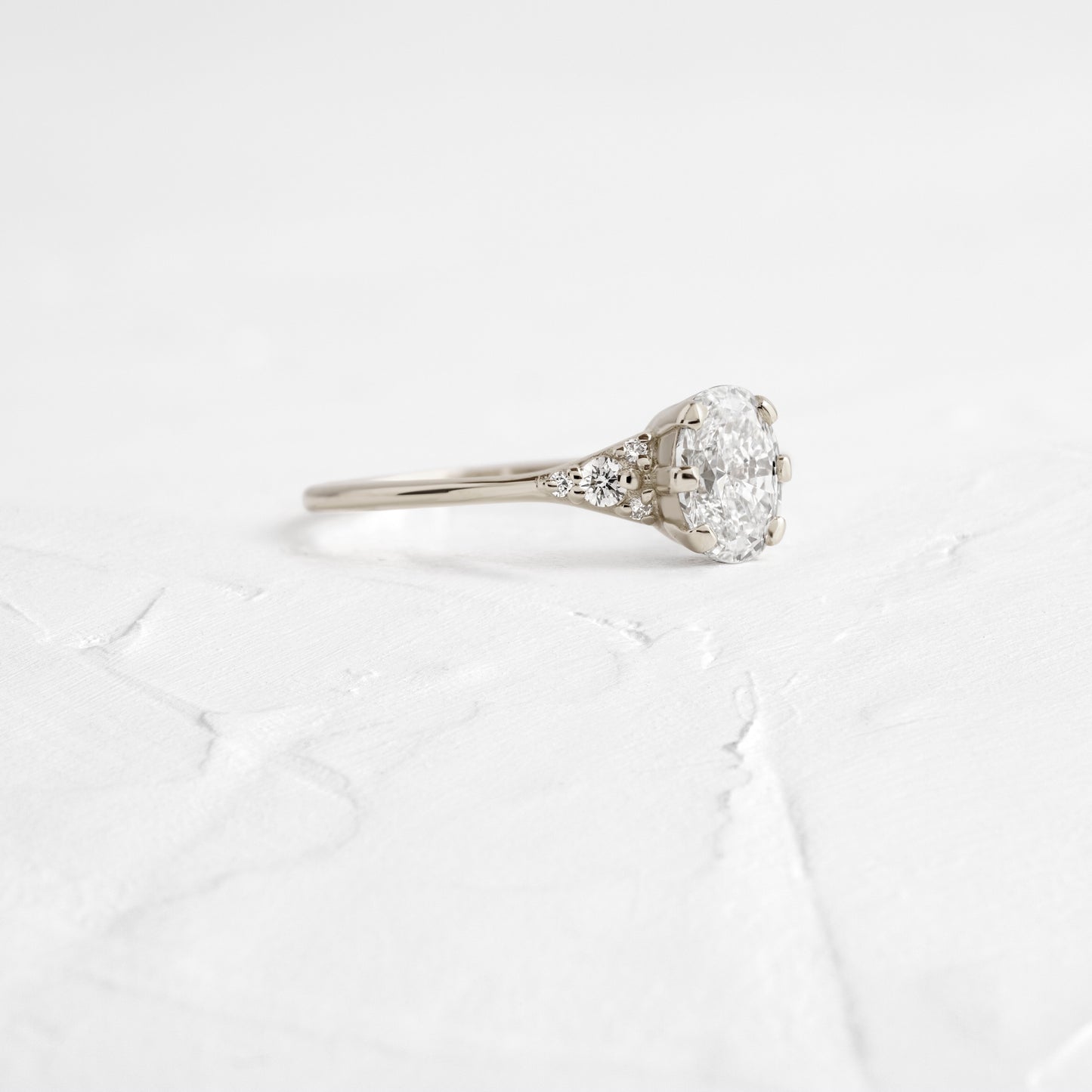 Cluster & Six Square Prong-Oval Lab Grown Diamond Engagement Ring - Front view
