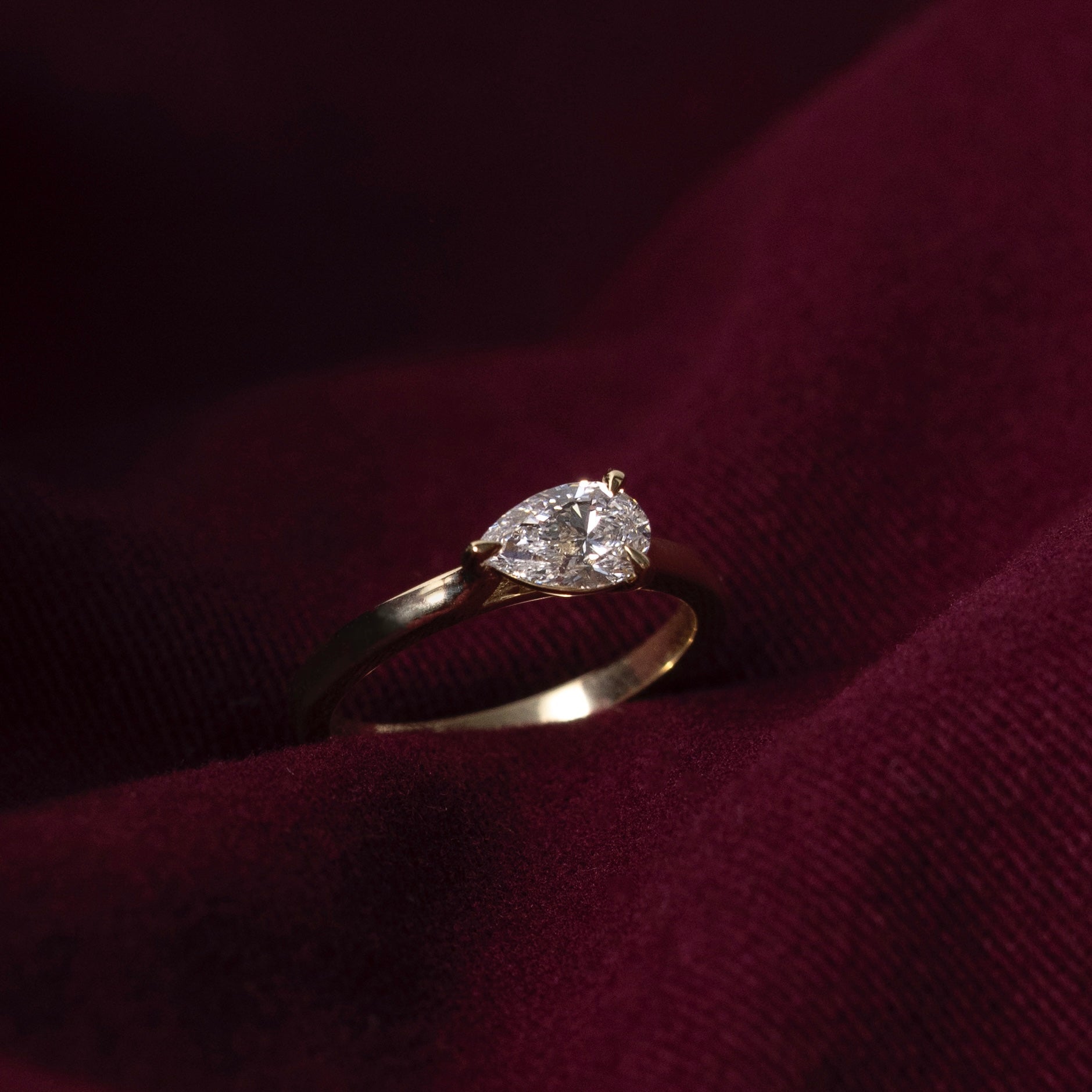 East West Solitaire Cathedral- 0.8 CT Pear Moissanite Engagement RingEast West Solitaire Cathedral- 0.8 CT Pear Moissanite Engagement Ring - Side view