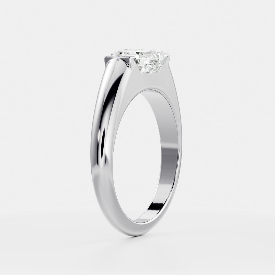 East West Solitaire Half Bezel- 1.5 CT Emerald Moissanite Engagement RingEast West Solitaire Half Bezel- 1.5 CT Emerald Moissanite Engagement Ring - On model