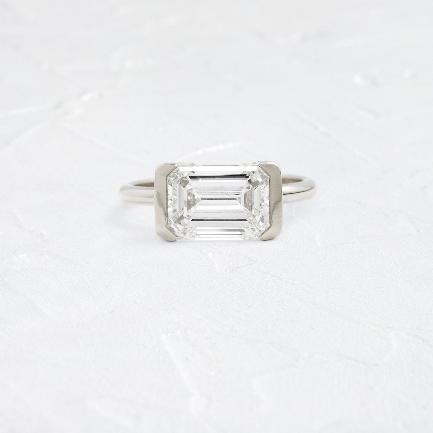 East West Solitaire Half Bezel-Emerald Lab Grown Diamond Engagement Ring - Back view