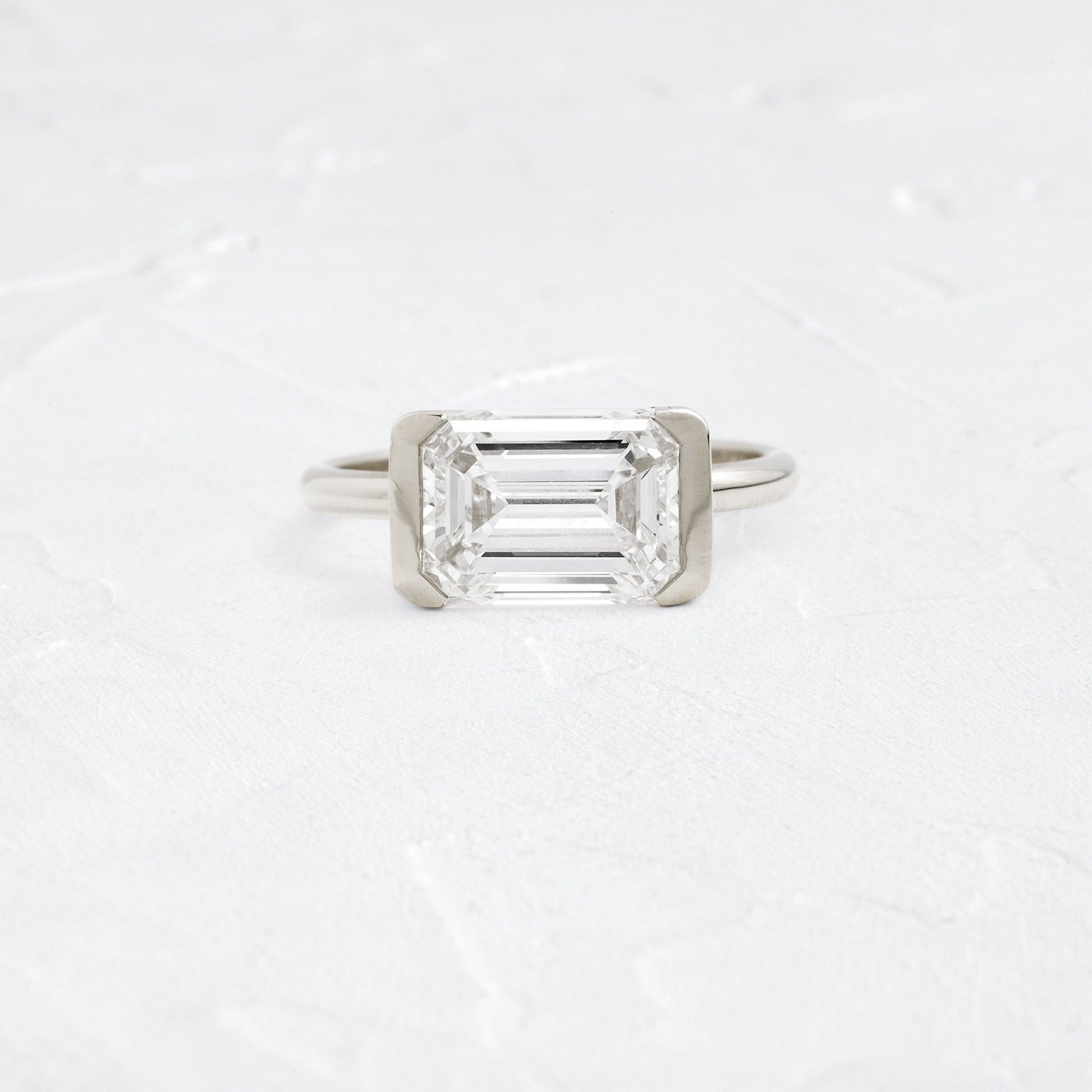 East West Solitaire Half Bezel-Emerald Lab Grown Diamond Engagement Ring - Back view