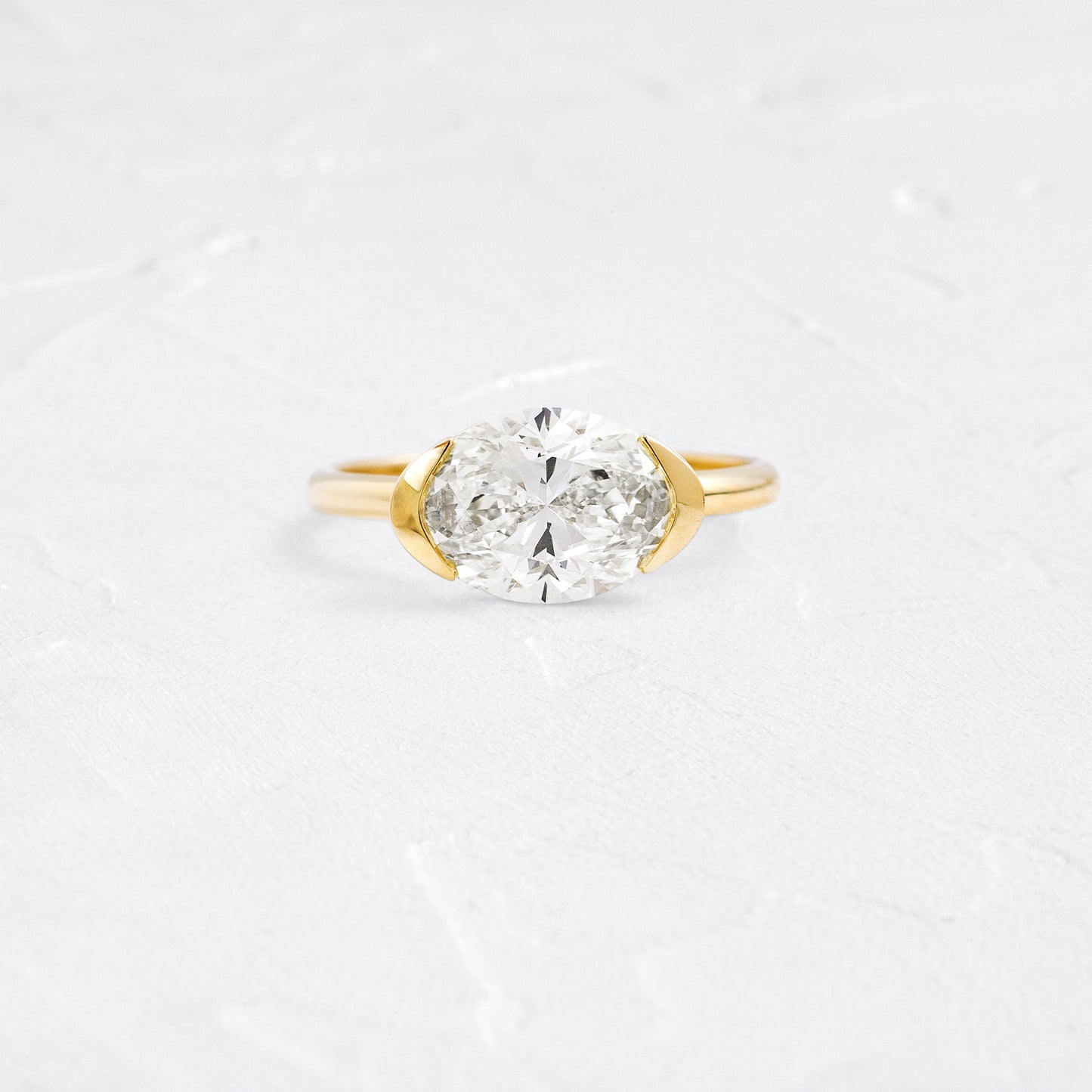 East West Solitaire Half Bezel-Oval Lab Grown Diamond Engagement Ring - Front view