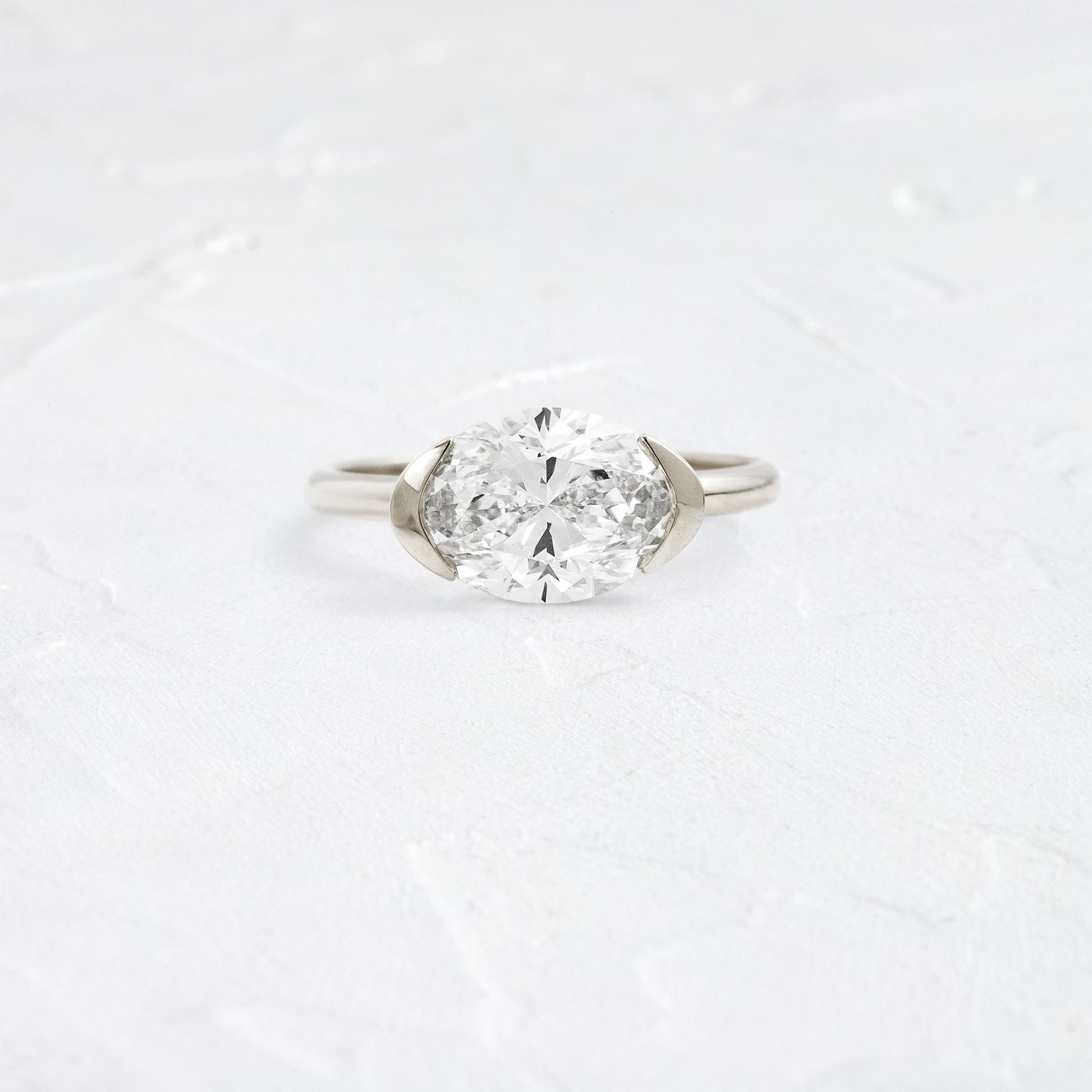 East West Solitaire Half Bezel-Oval Lab Grown Diamond Engagement Ring - Back view