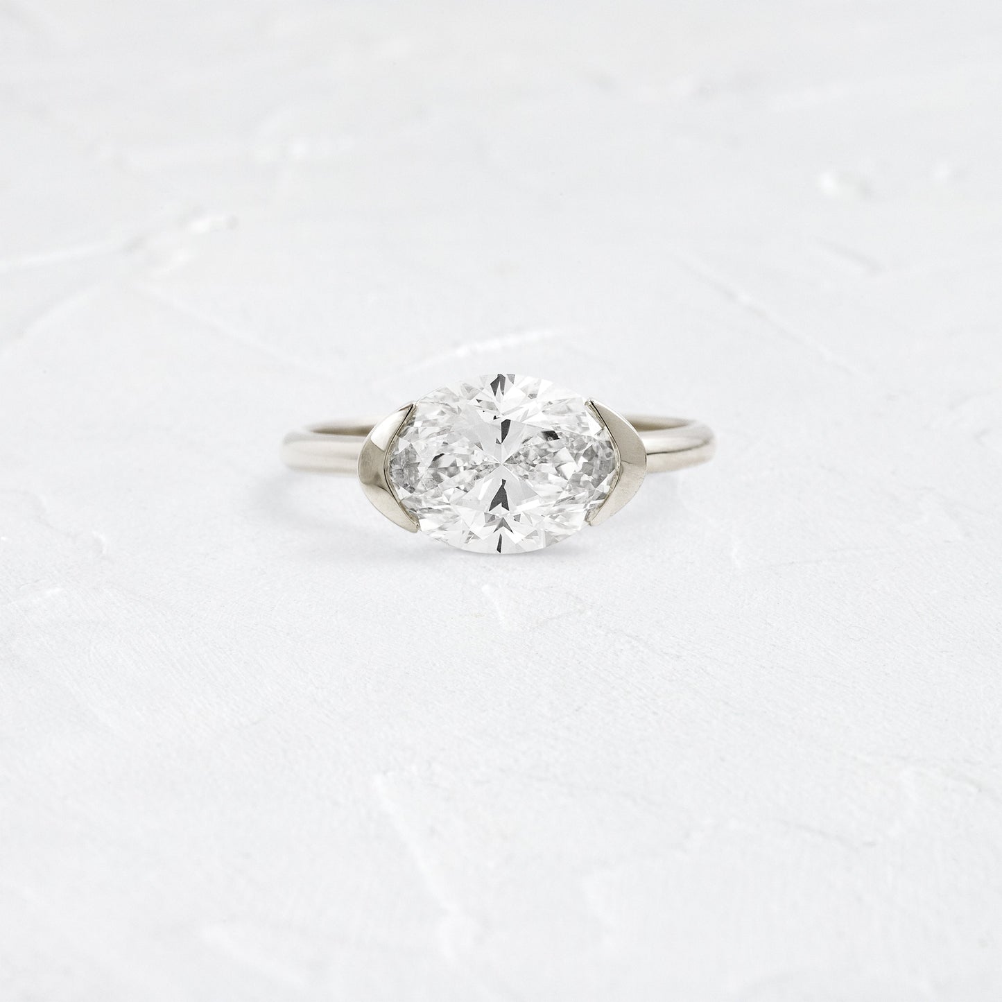 East West Solitaire Half Bezel-Oval Lab Grown Diamond Engagement Ring - Back view
