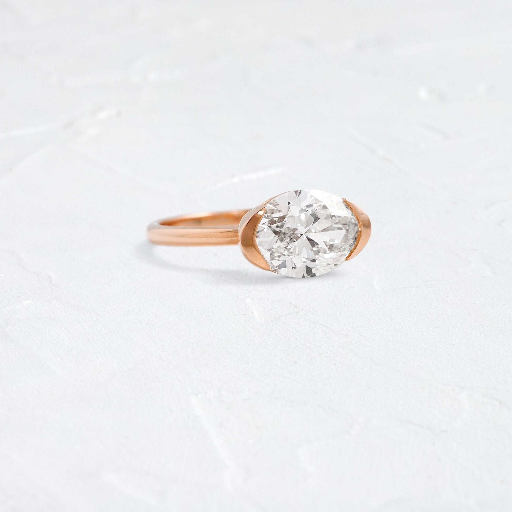 East West Solitaire Half Bezel-Oval Lab Grown Diamond Engagement Ring - Front view
