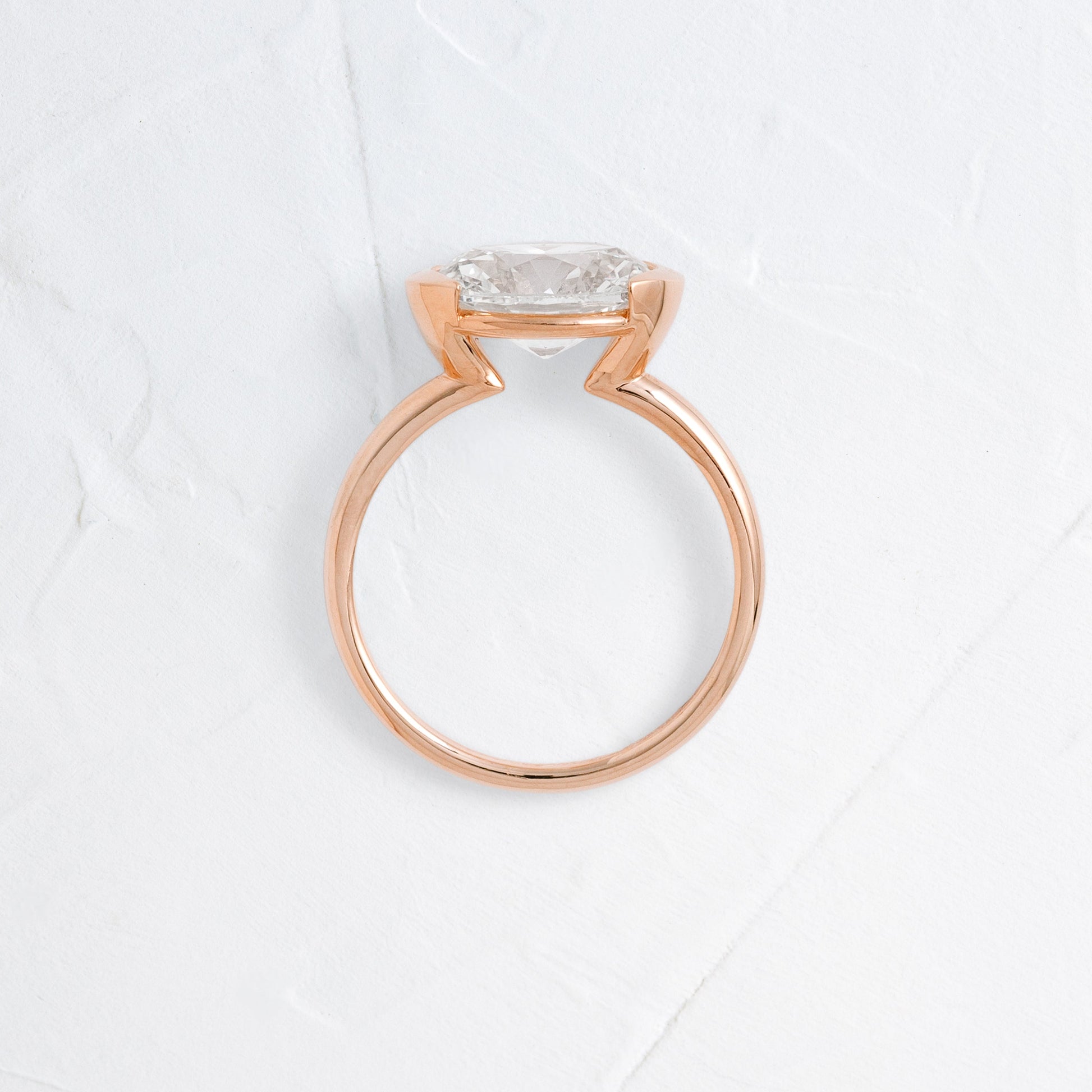 East West Solitaire Half Bezel-Oval Lab Grown Diamond Engagement Ring - Side view