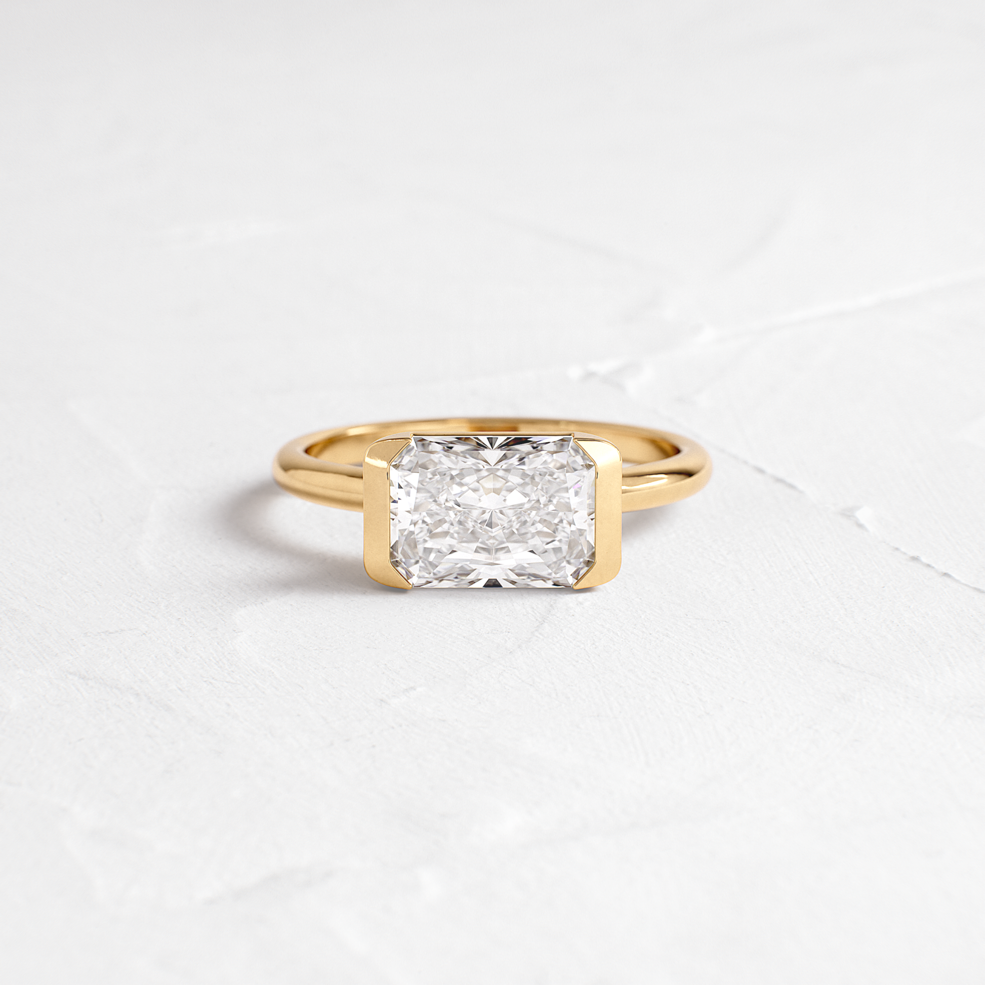 East West Solitaire Half Bezel-Radiant Lab Grown Diamond Engagement Ring - Front view