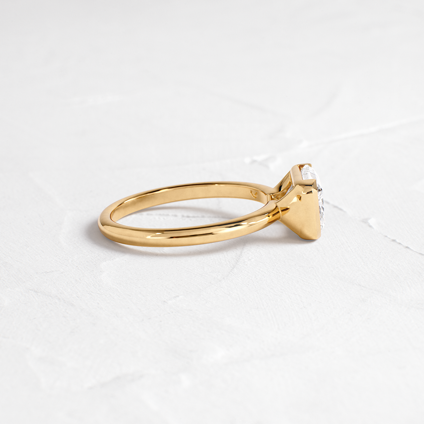 East West Solitaire Half Bezel-Radiant Lab Grown Diamond Engagement Ring - Side view