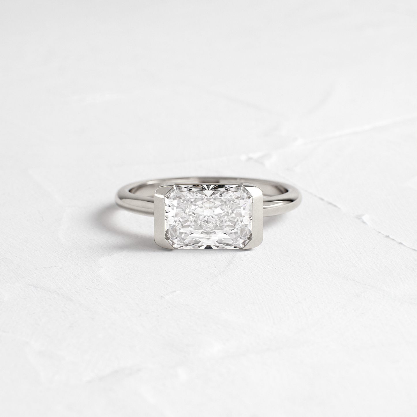 East West Solitaire Half Bezel-Radiant Lab Grown Diamond Engagement Ring - Detail view