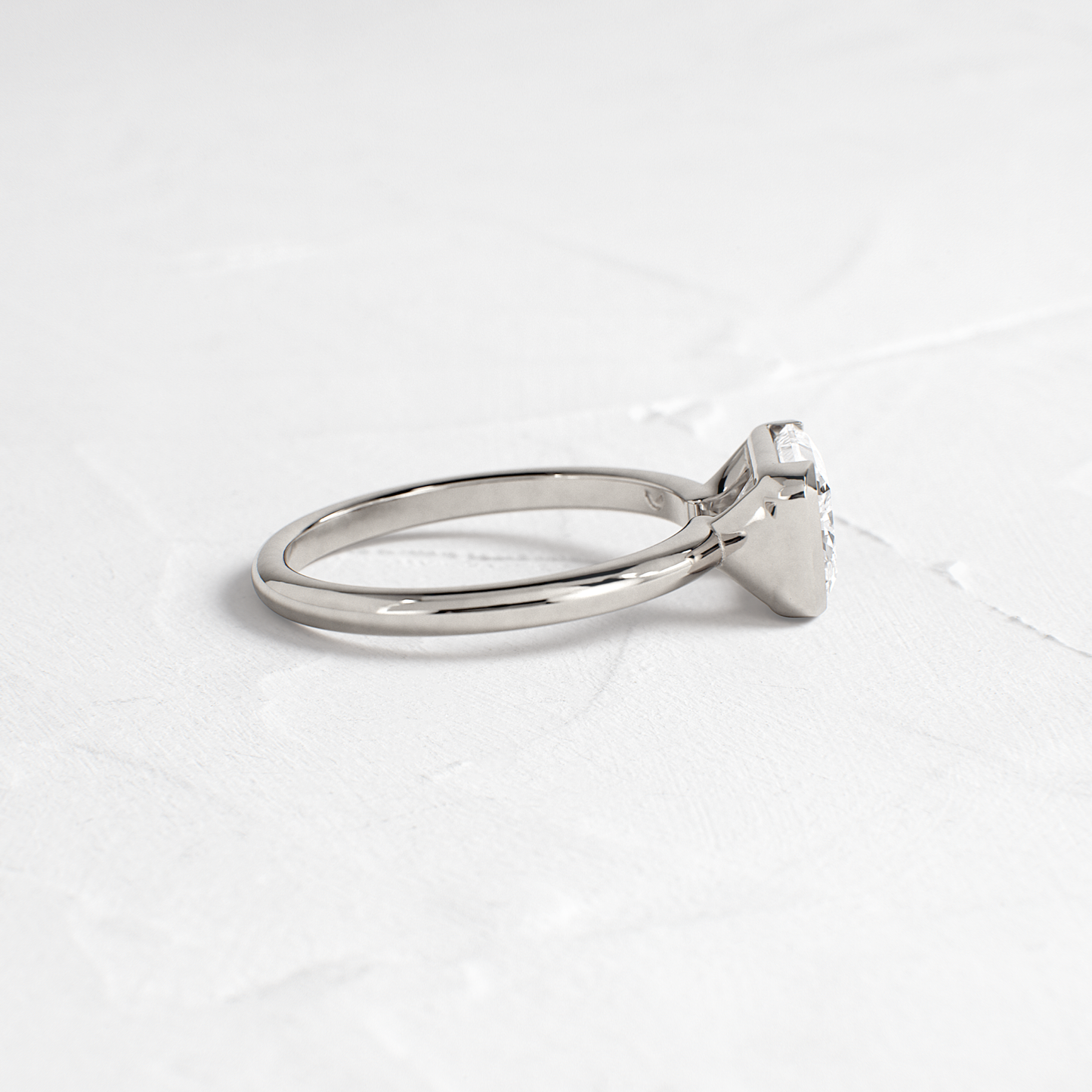East West Solitaire Half Bezel-Radiant Lab Grown Diamond Engagement Ring - Lifestyle