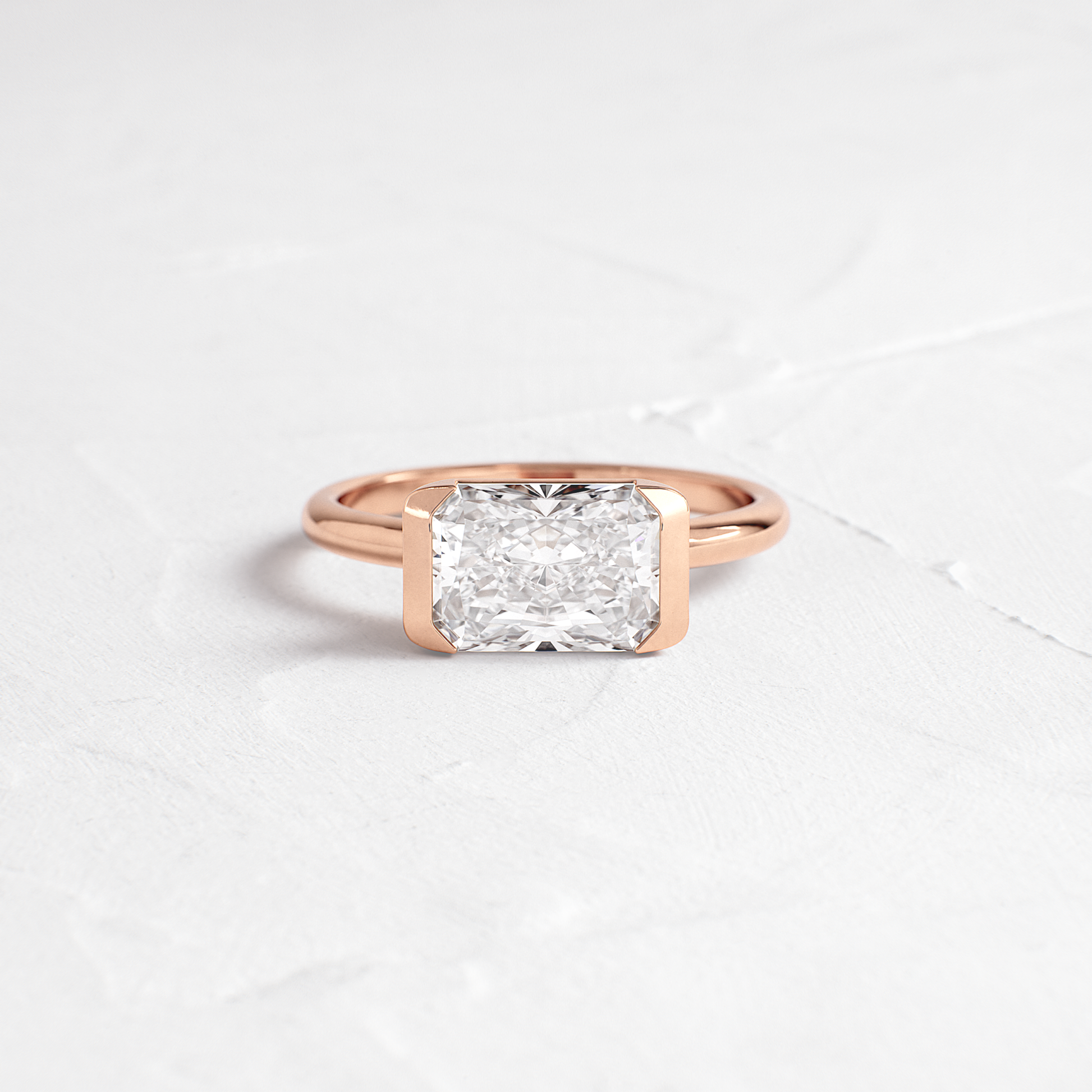 East West Solitaire Half Bezel-Radiant Lab Grown Diamond Engagement Ring - Side view