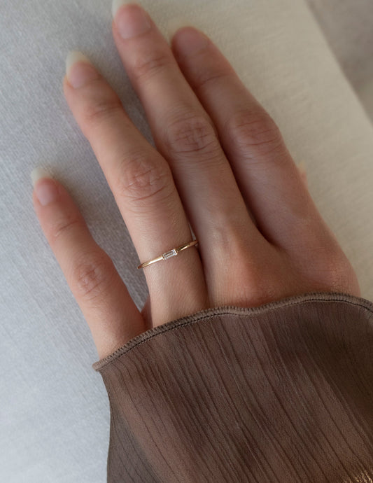 East West Solitaire Half Bezel | Stackable Ring- 0.06 CT Baguette Moissanite Wedding BandEast West Solitaire Half Bezel | Stackable Ring- 0.06 CT Baguette Moissanite Wedding Band - Front view