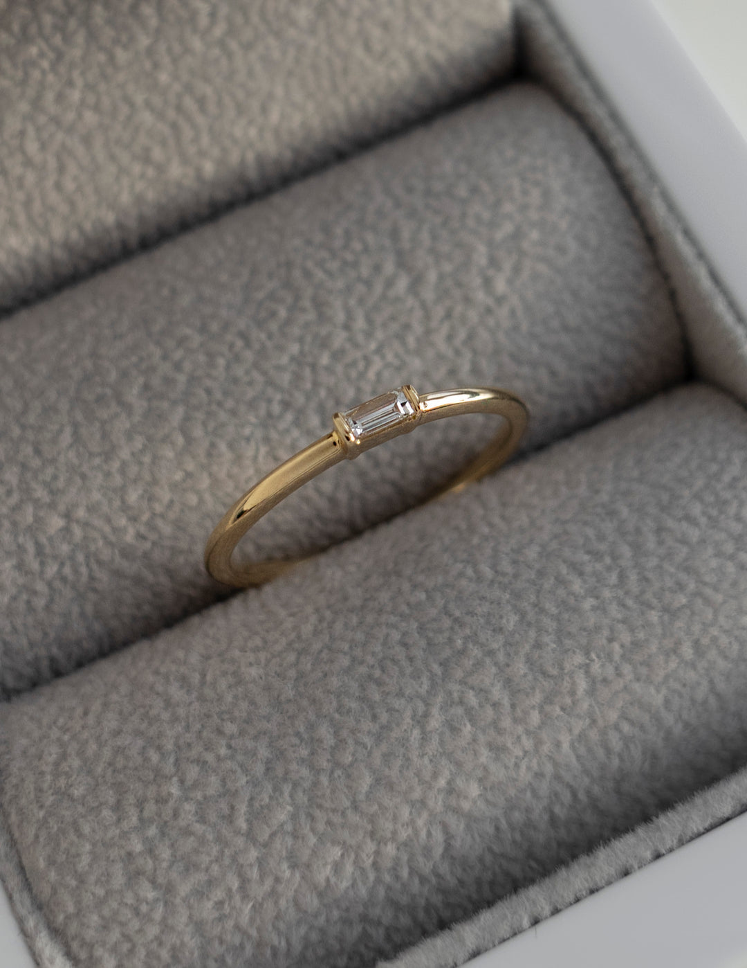East West Solitaire Half Bezel | Stackable Ring- 0.06 CT Baguette Moissanite Wedding BandEast West Solitaire Half Bezel | Stackable Ring- 0.06 CT Baguette Moissanite Wedding Band - Front view