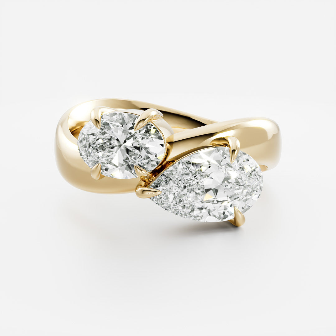 East West Toi Et Moi Curved Band- 1.33 CT Pear & 1.3 CT Oval Moissanite Engagement RingEast West Toi Et Moi Curved Band- 1.33 CT Pear & 1.3 CT Oval Moissanite Engagement Ring - Front view
