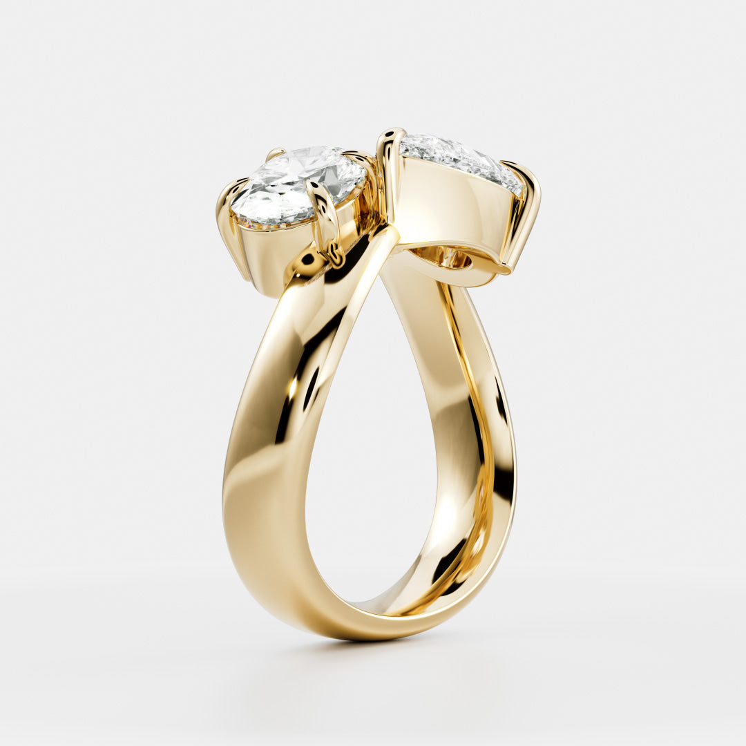 East West Toi Et Moi Curved Band- 1.33 CT Pear & 1.3 CT Oval Moissanite Engagement RingEast West Toi Et Moi Curved Band- 1.33 CT Pear & 1.3 CT Oval Moissanite Engagement Ring - Front view