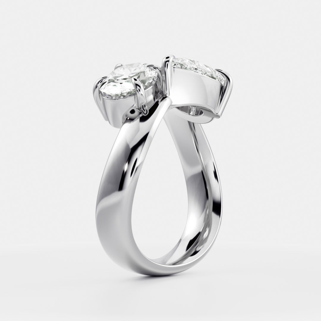 East West Toi Et Moi Curved Band- 1.33 CT Pear & 1.3 CT Oval Moissanite Engagement RingEast West Toi Et Moi Curved Band- 1.33 CT Pear & 1.3 CT Oval Moissanite Engagement Ring - Lifestyle