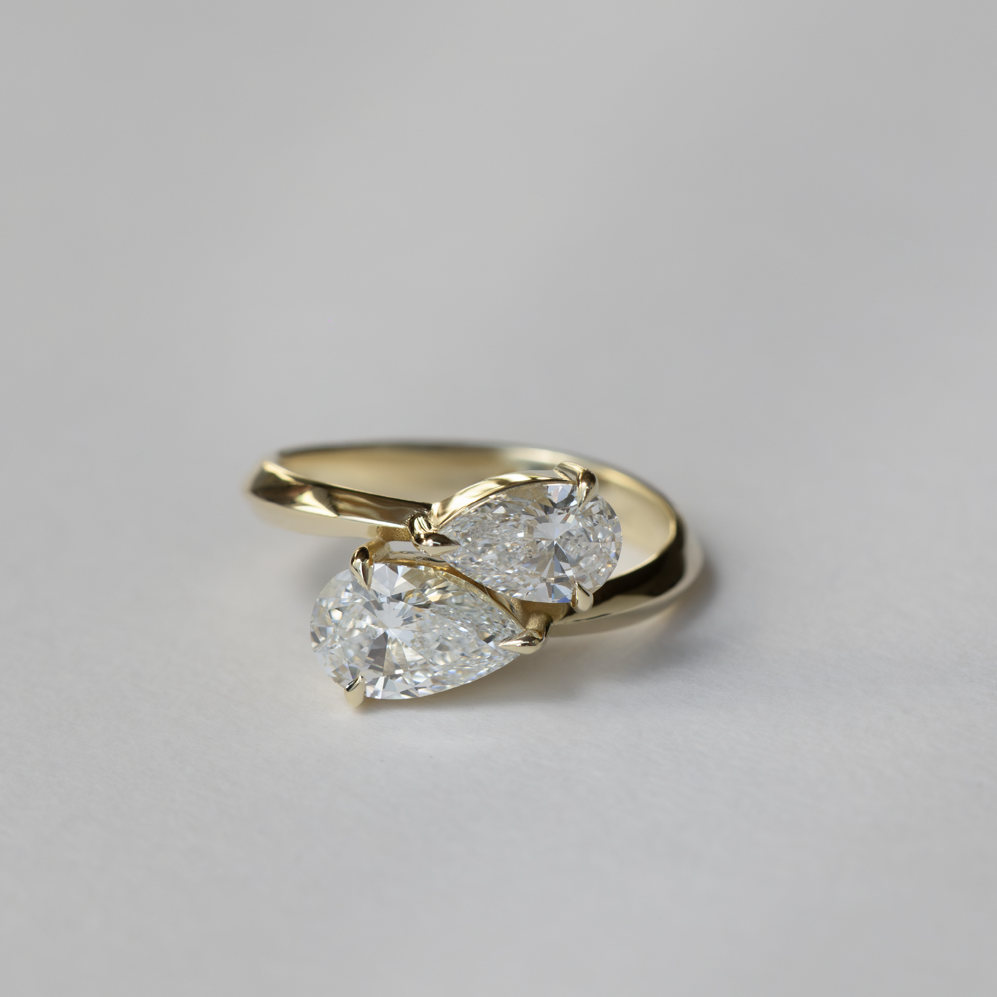 East West Toi Et Moi Knife Edge- 1.3 CT Pear & 0.8 CT Pear Moissanite Engagement RingEast West Toi Et Moi Knife Edge- 1.3 CT Pear & 0.8 CT Pear Moissanite Engagement Ring - Side view