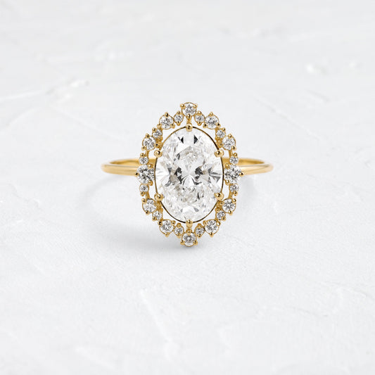 Graduated Halo-Oval Lab Grown Diamond Engagement Ring - Front view
