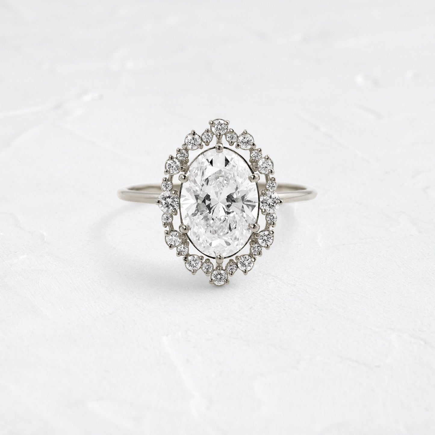 Graduated Halo-Oval Lab Grown Diamond Engagement Ring - Detail view