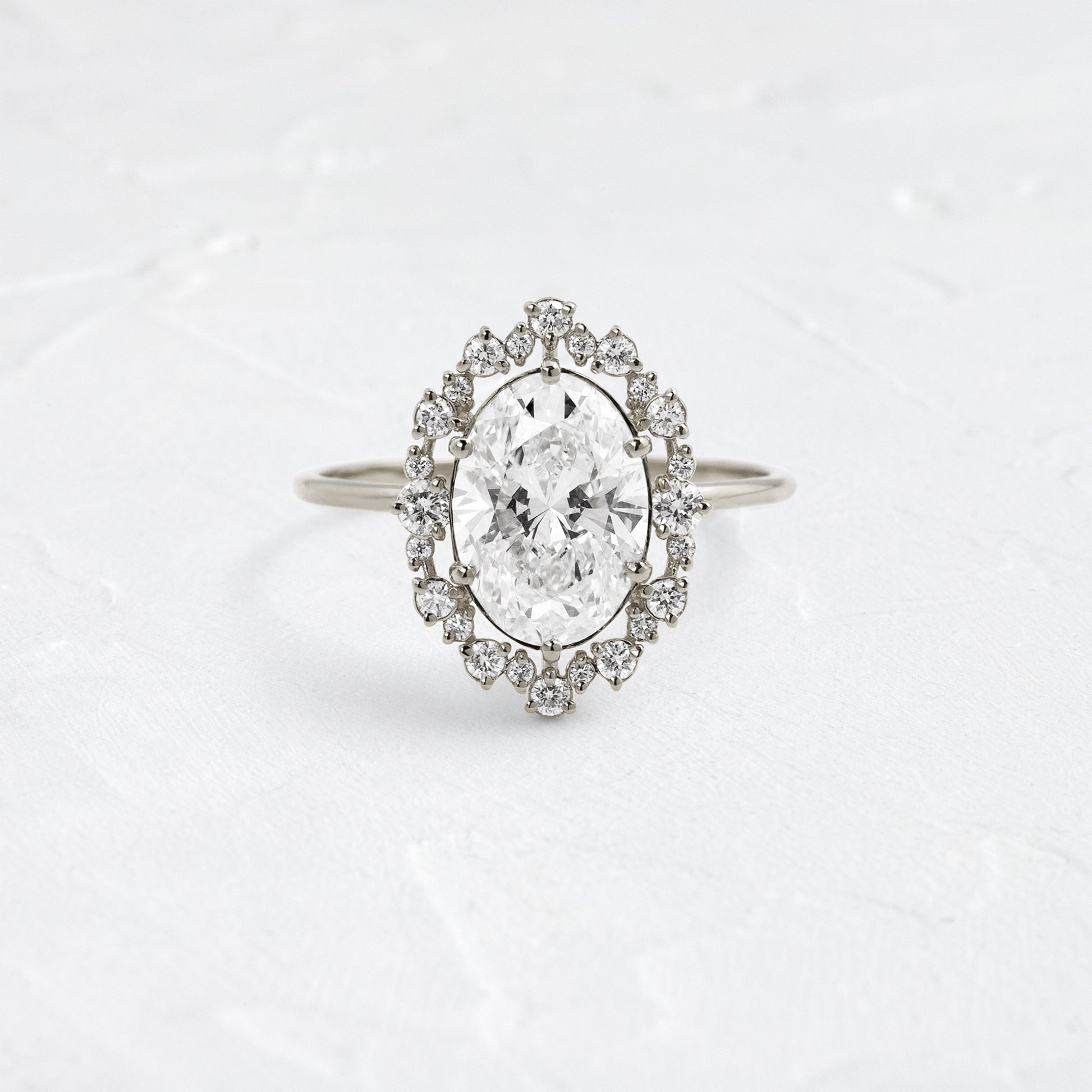 Graduated Halo-Oval Lab Grown Diamond Engagement Ring - Detail view