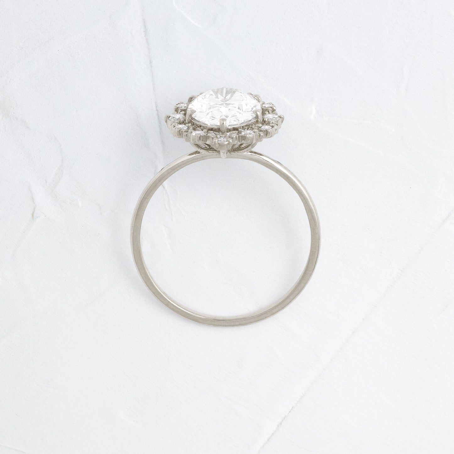 Graduated Halo-Oval Lab Grown Diamond Engagement Ring - Front view