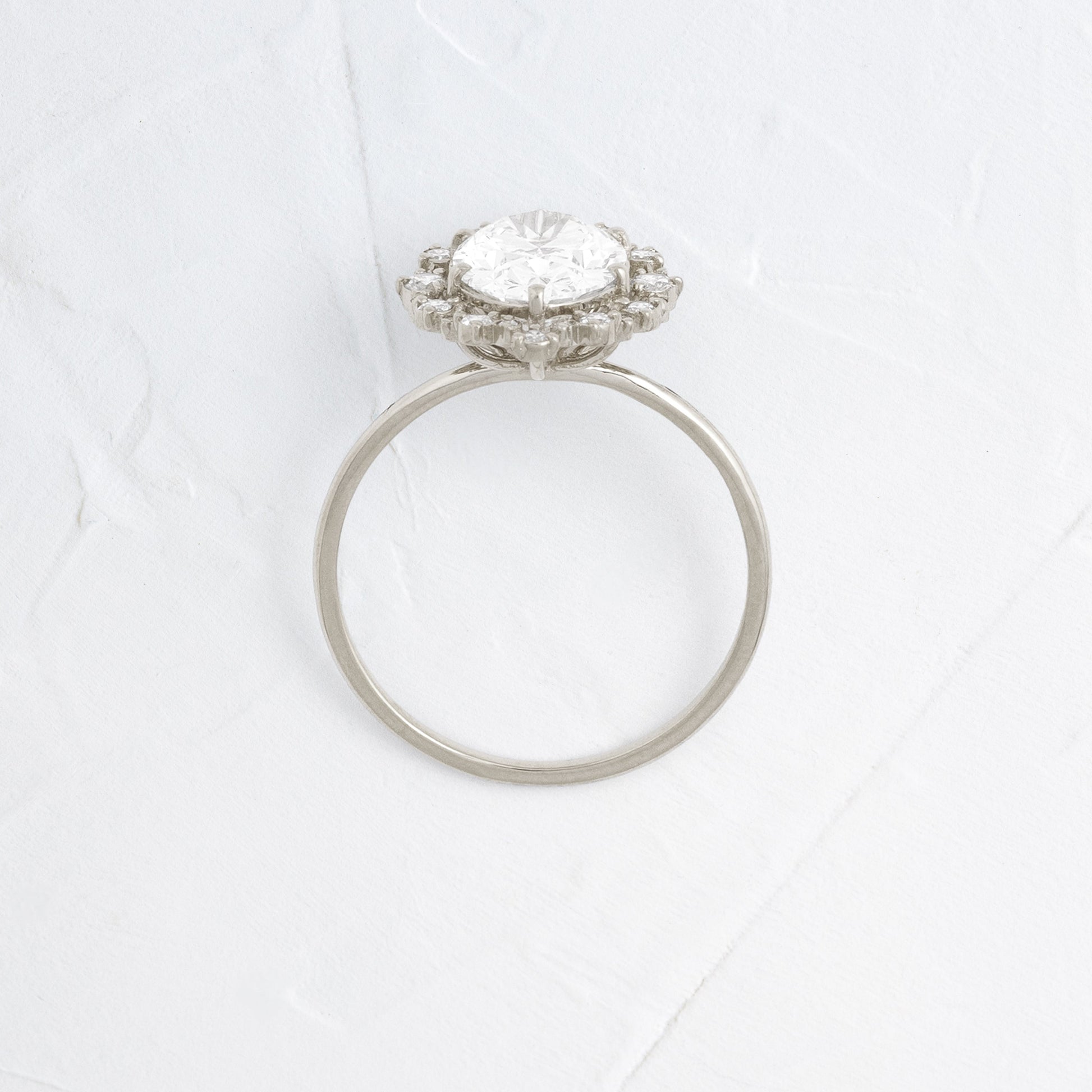 Graduated Halo-Oval Lab Grown Diamond Engagement Ring - Front view