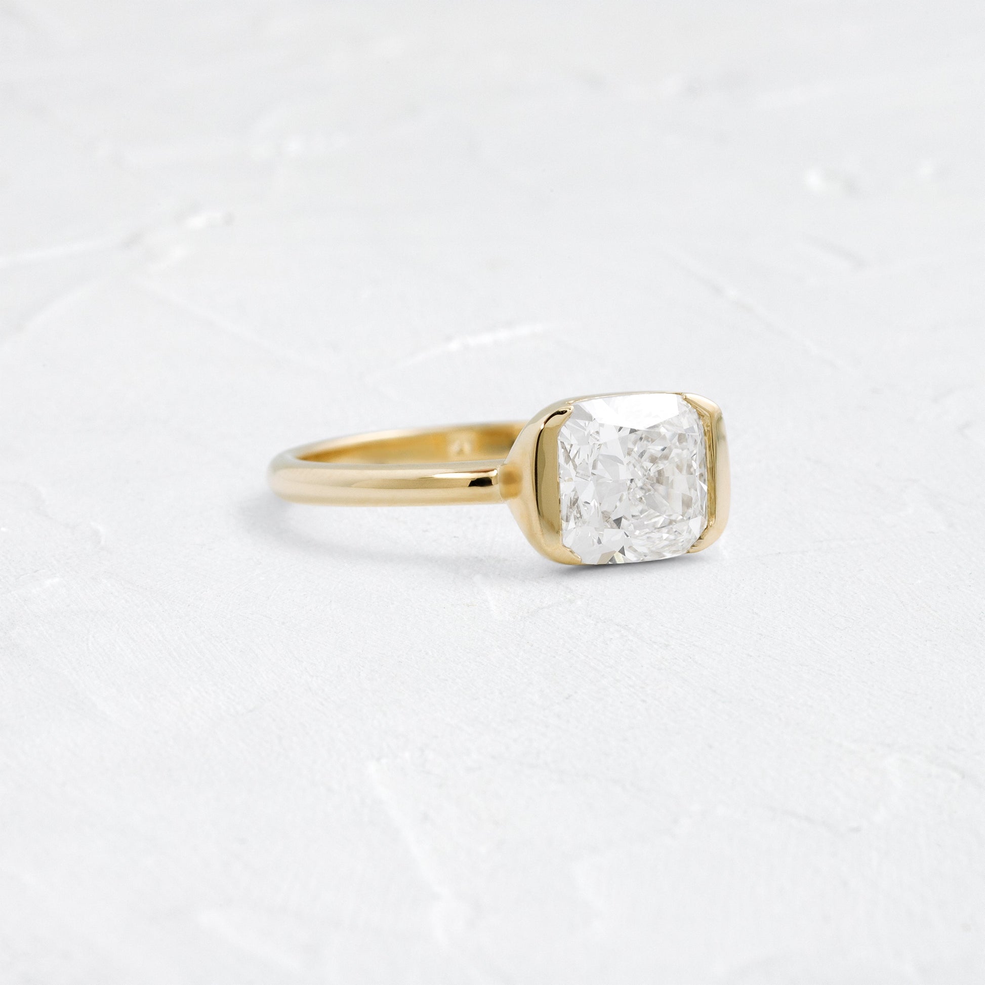 Half Bezel & East West-Elongated Cushion Lab Grown Diamond Engagement Ring - Front view