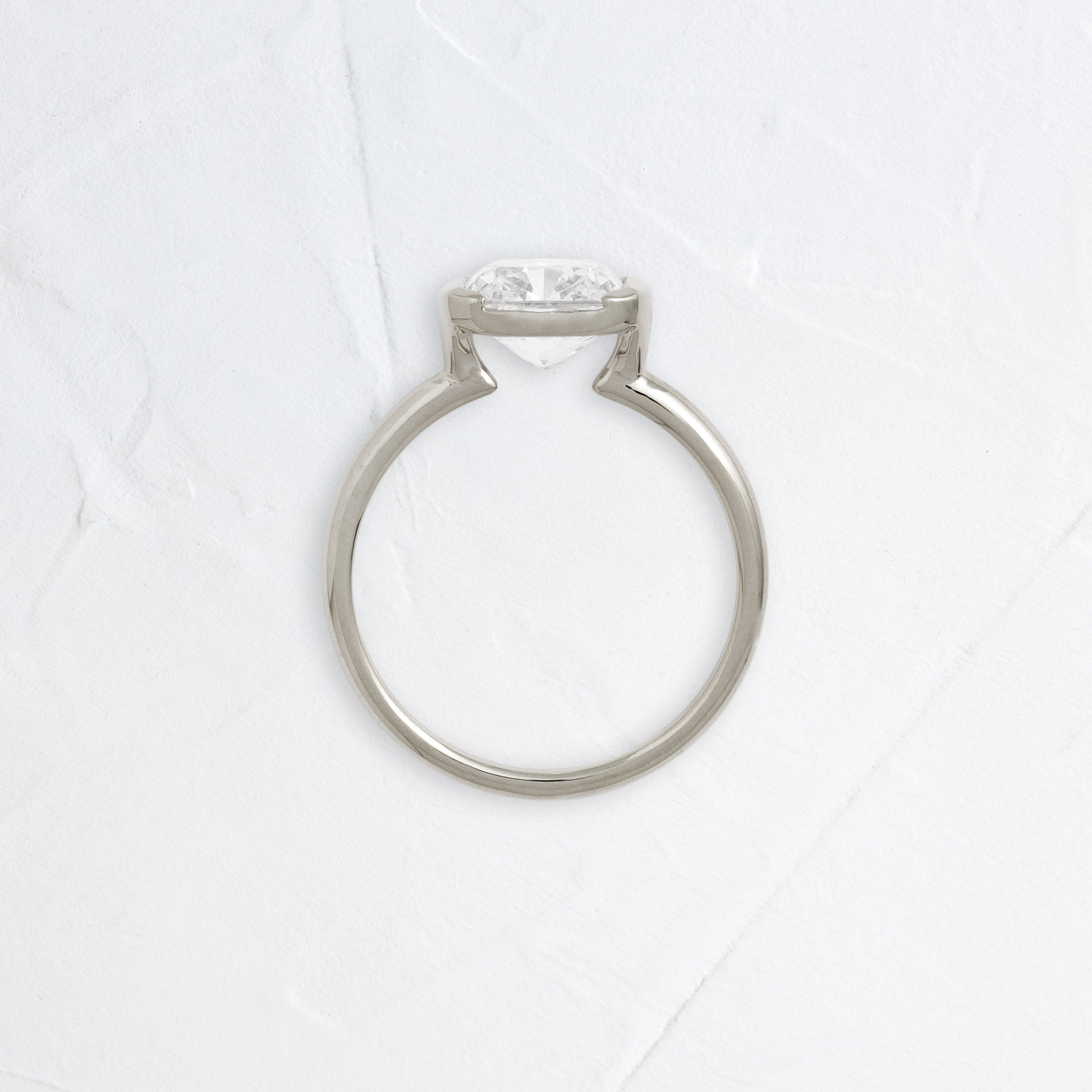 Half Bezel & East West-Elongated Cushion Lab Grown Diamond Engagement Ring - Front view
