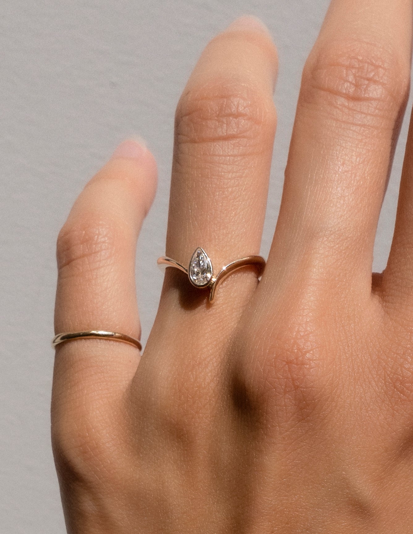 Solitaire Bezel Asymmetrical Band-Pear Lab Grown Diamond Engagement Ring - Detail view