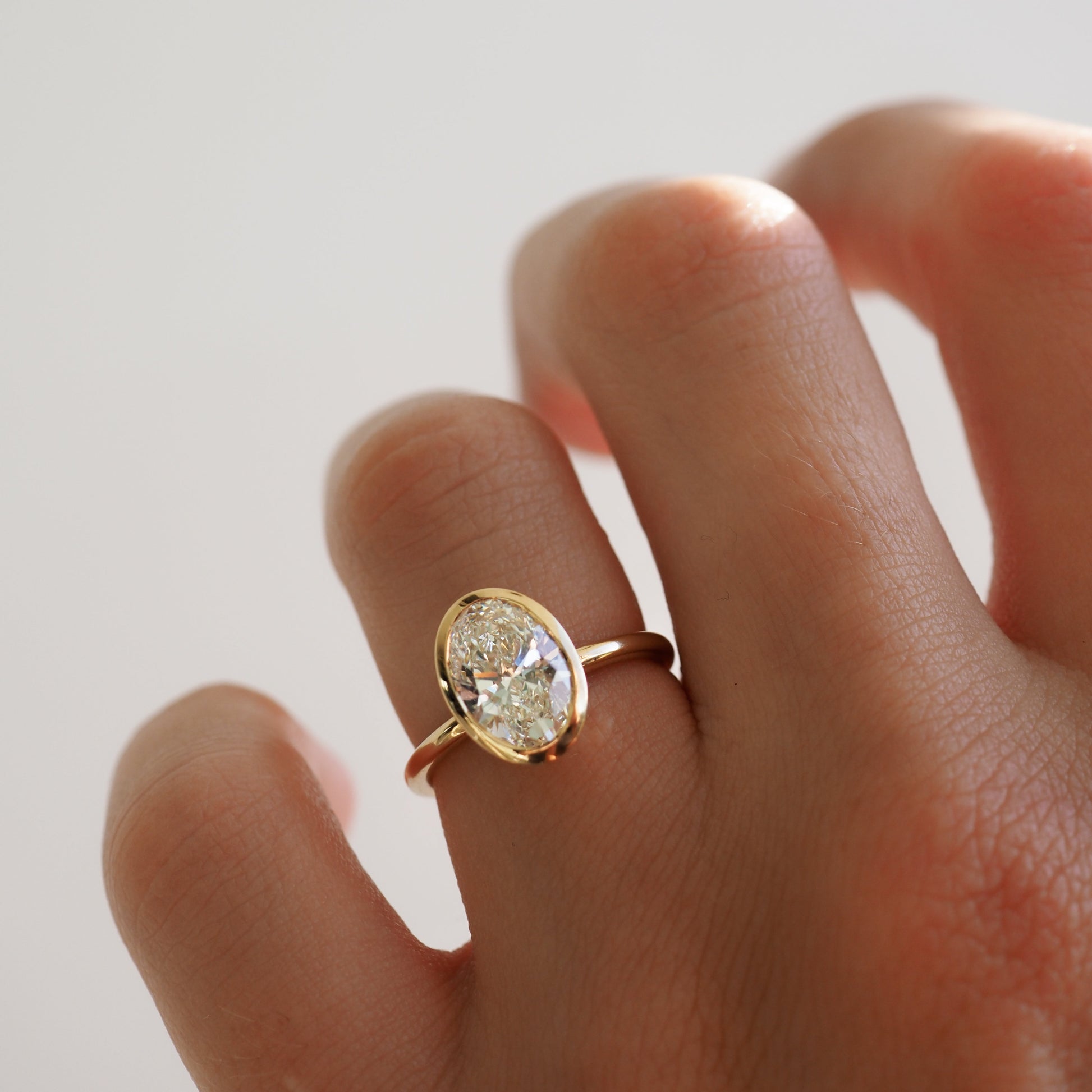 Solitaire Bezel-Oval Lab Grown Diamond Engagement Ring - Side view