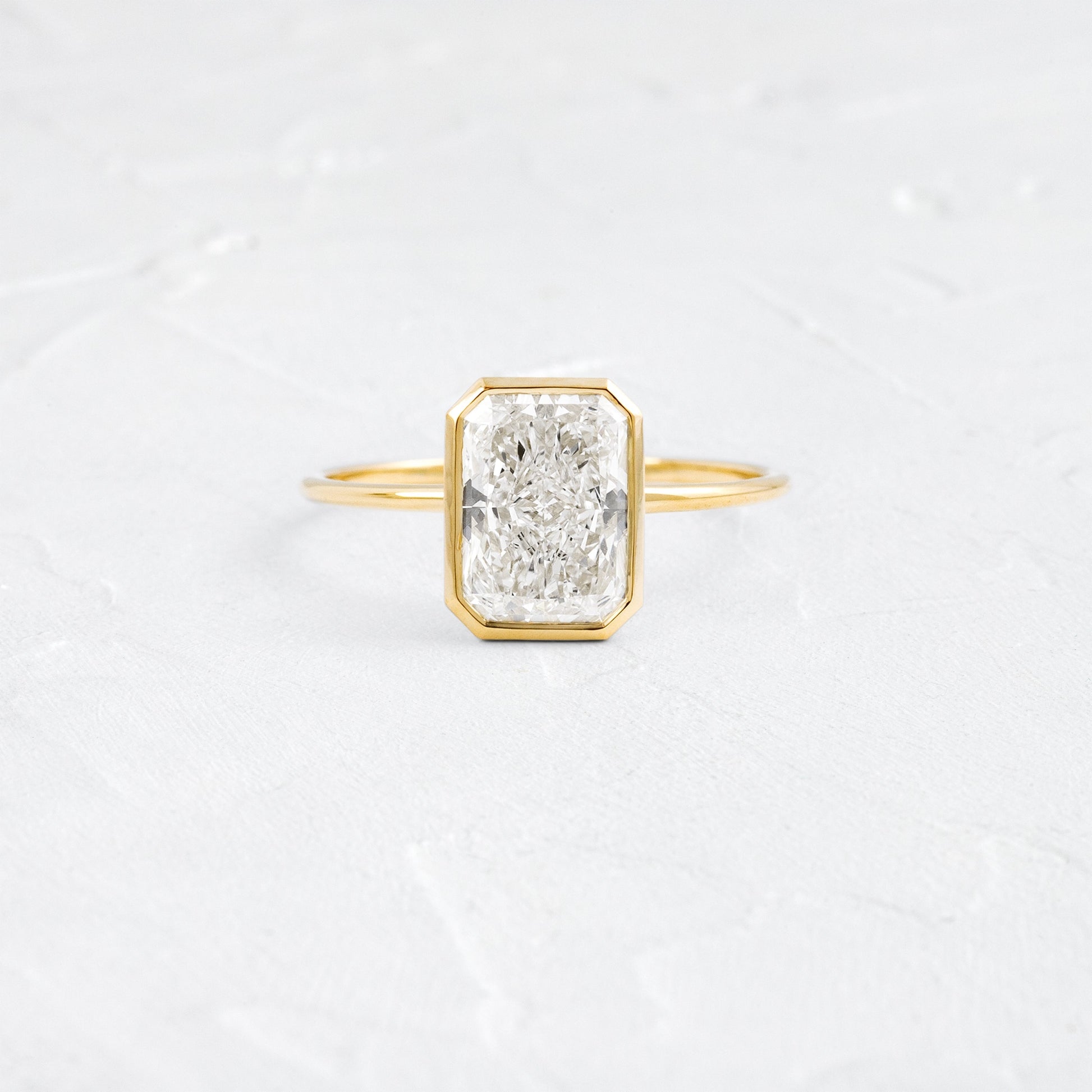 Solitaire Bezel with Hidden Stone-Radiant Lab Grown Diamond Engagement Ring - Front view