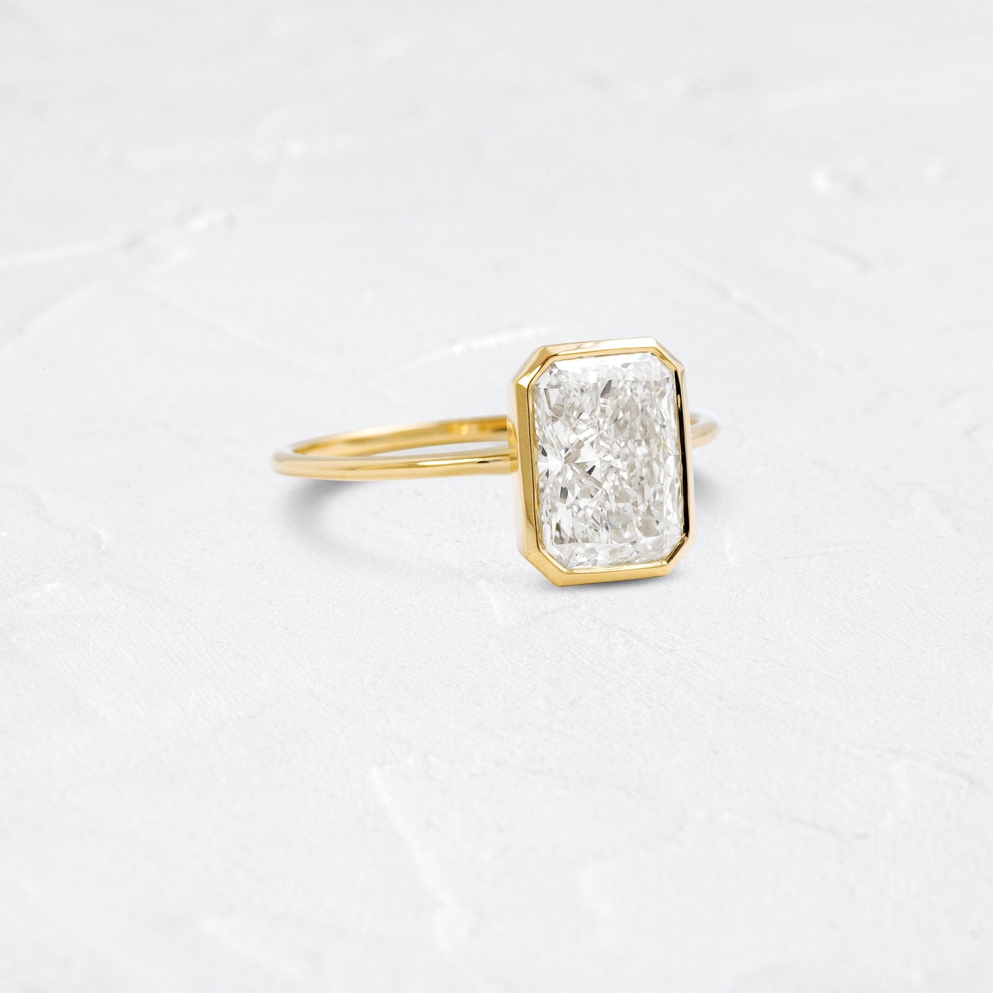 Solitaire Bezel with Hidden Stone-Radiant Lab Grown Diamond Engagement Ring - Front view