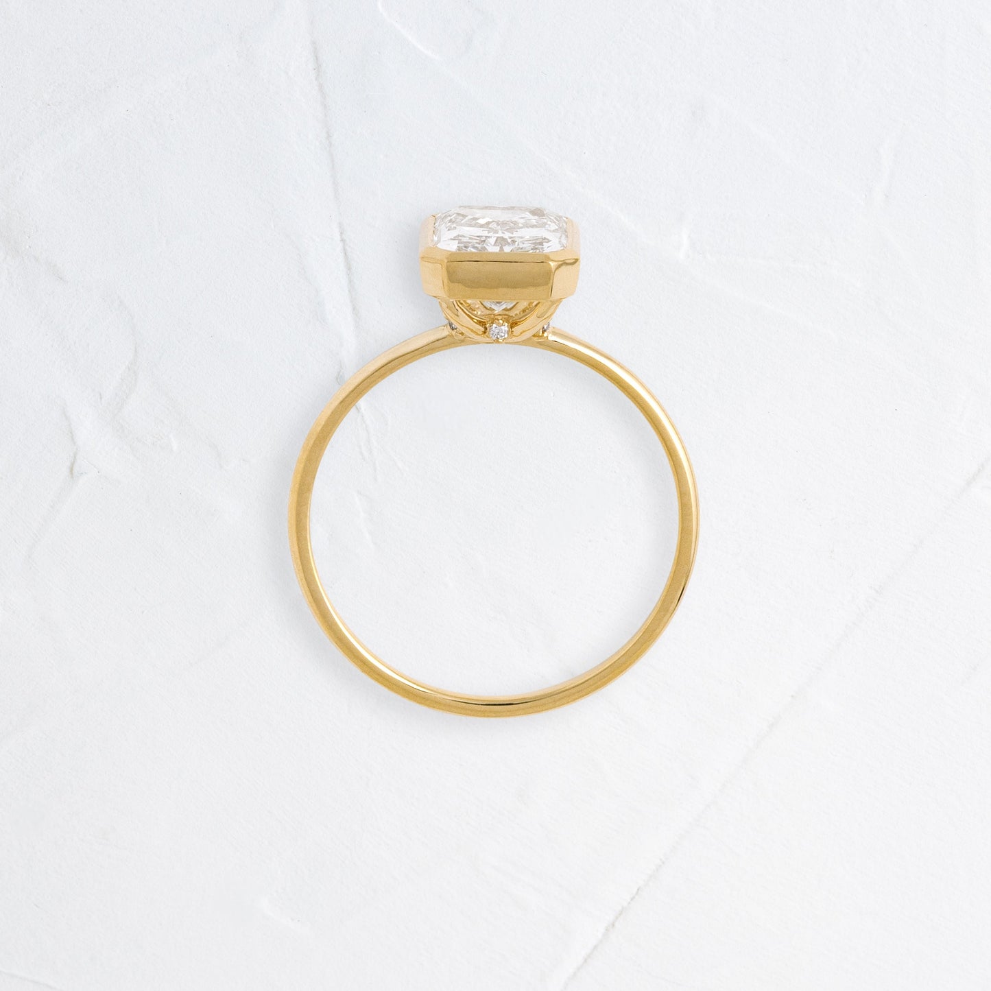Solitaire Bezel with Hidden Stone-Radiant Lab Grown Diamond Engagement Ring - Side view