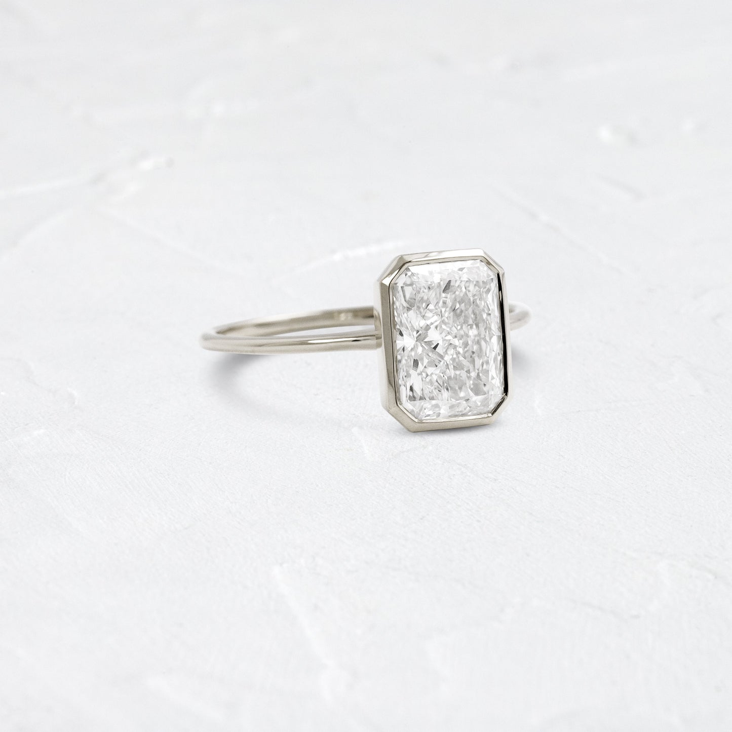 Solitaire Bezel with Hidden Stone-Radiant Lab Grown Diamond Engagement Ring - Detail view