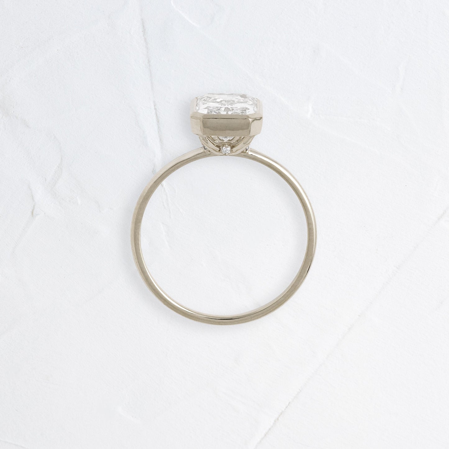 Solitaire Bezel with Hidden Stone-Radiant Lab Grown Diamond Engagement Ring - On model