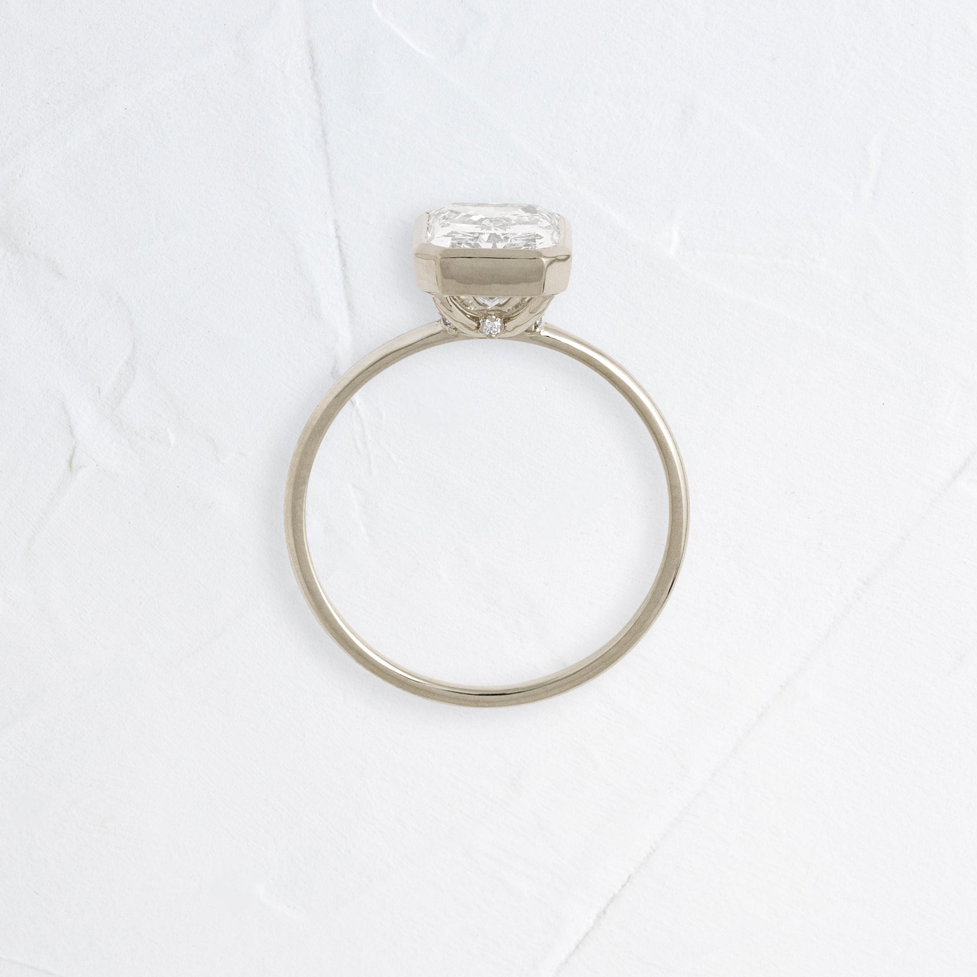 Solitaire Bezel with Hidden Stone-Radiant Lab Grown Diamond Engagement Ring - On model