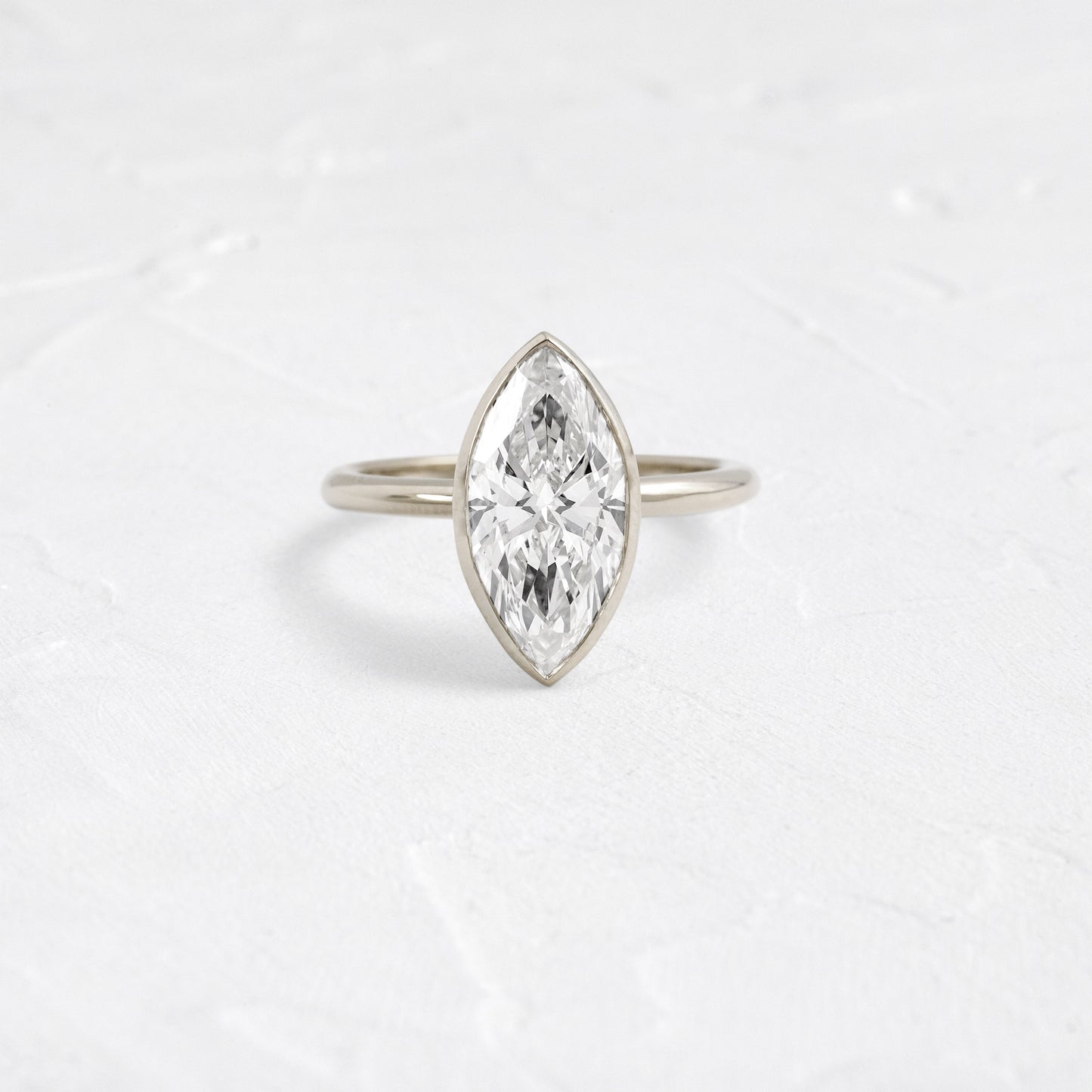 Solitaire Bezel with Hidden Stones-Marquise Lab Grown Diamond Engagement Ring - Detail view