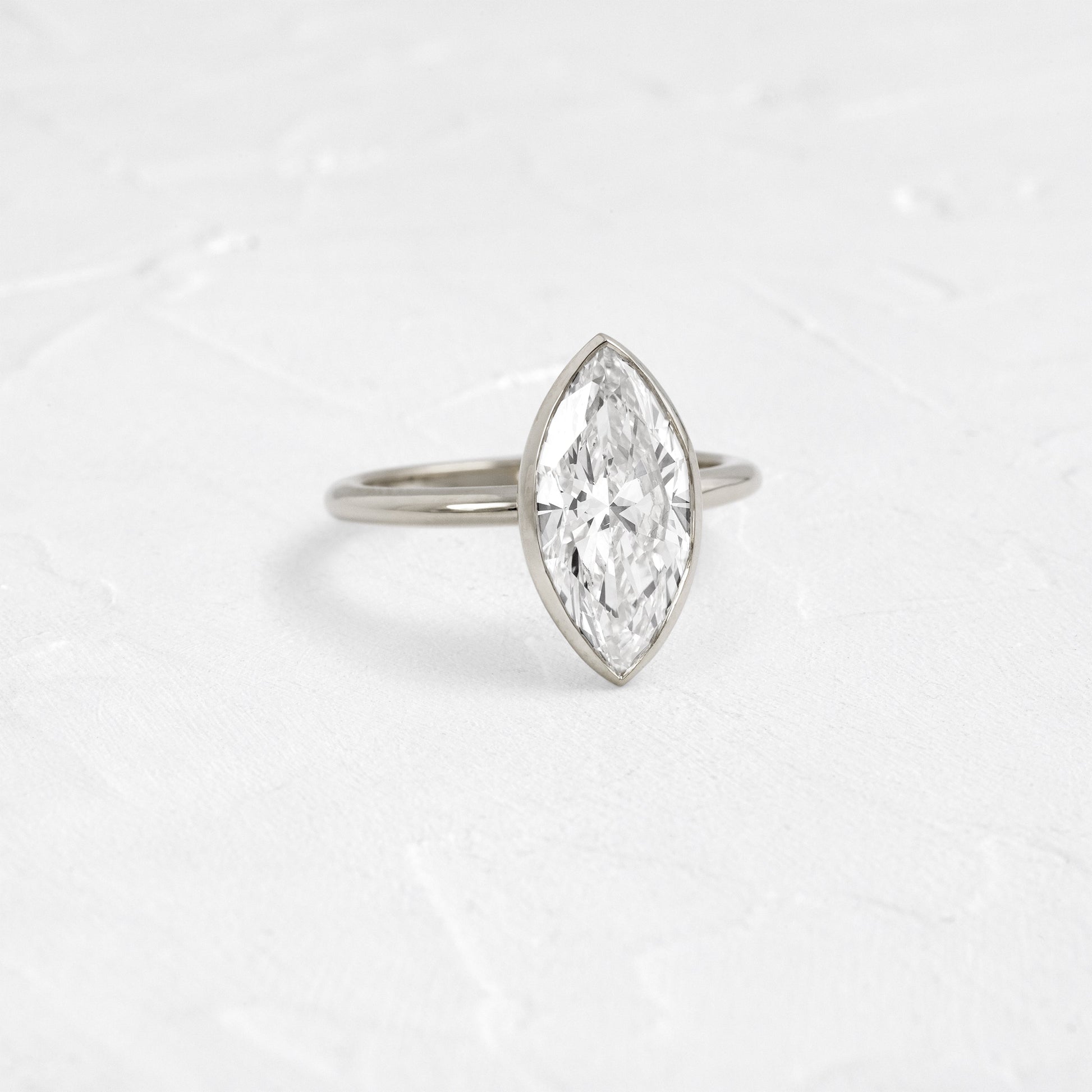 Solitaire Bezel with Hidden Stones-Marquise Lab Grown Diamond Engagement Ring - On model